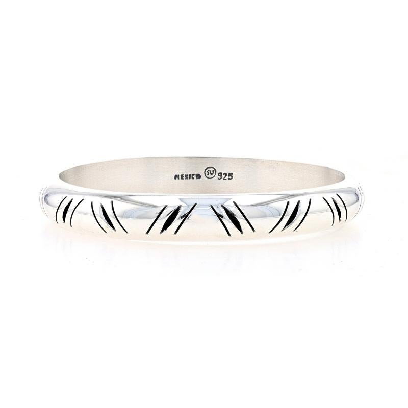 Metal Content: Sterling Silver

Style: Bangle
Fastening Type: N/A (slides over wrist)
Theme: Diagonal Stripes
Features: Hollow Construction with Etched Detailing

Measurements

Inner Circumference: 8