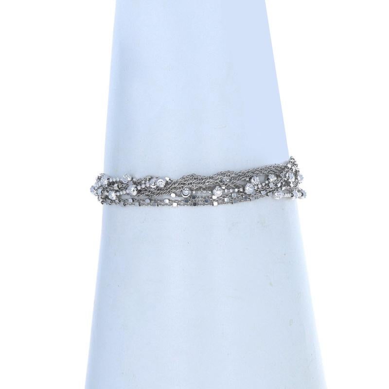 Metal Content: Sterling Silver

Style: Ten-Strand
Chain Style: Fancy Diamond Cut Bead, Fancy Diamond Cut Cable, & Prince of Wales
Bracelet Style: Chain
Fastening Type: Magnetic Clasp

Measurements

Length: 7