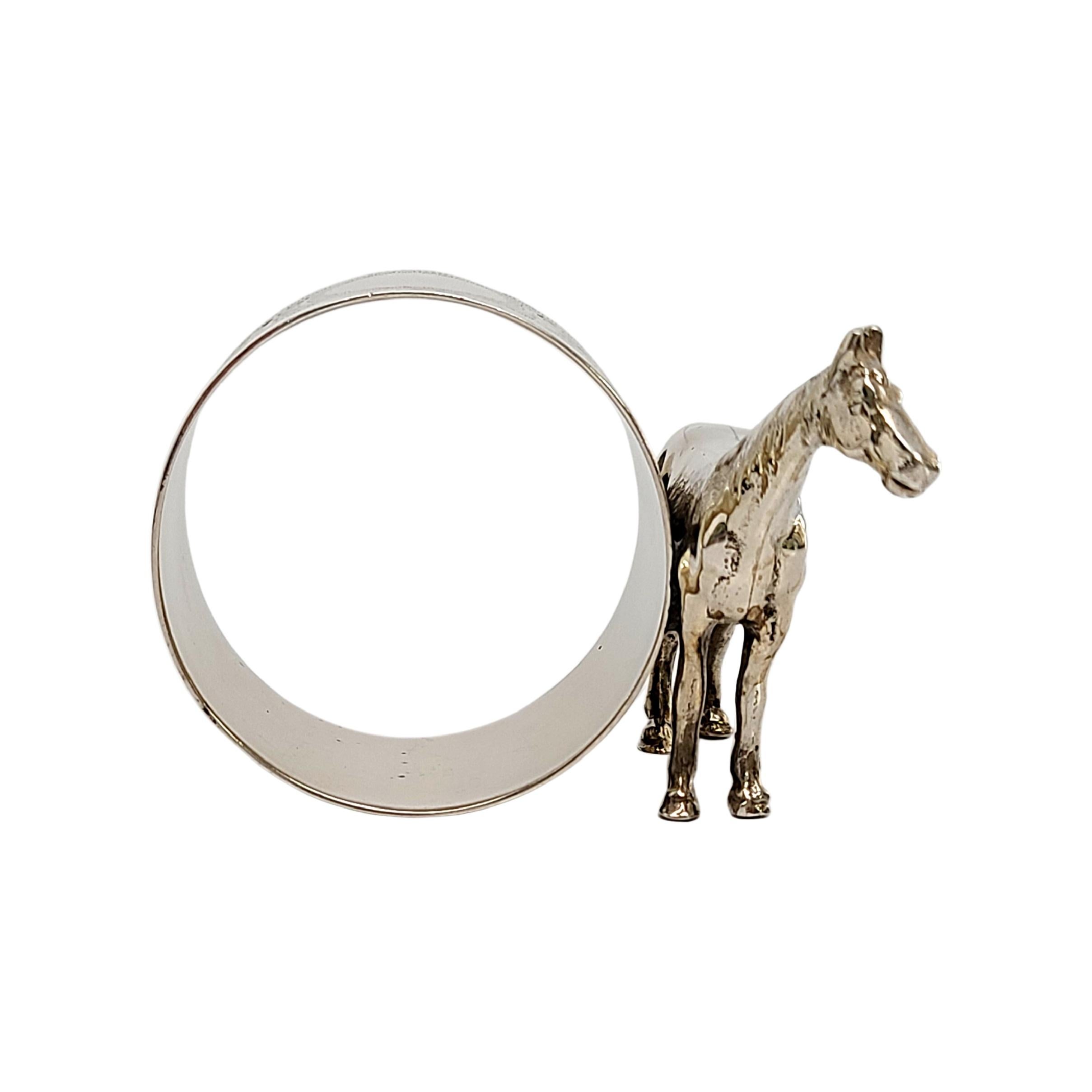 Sterling silver figural horse napkin ring.

No monogram.

Etched floral design around the ring, round framed empty cartouche, perfect for engraving. Large figural horse on one side.

Horse measures 1 5/8