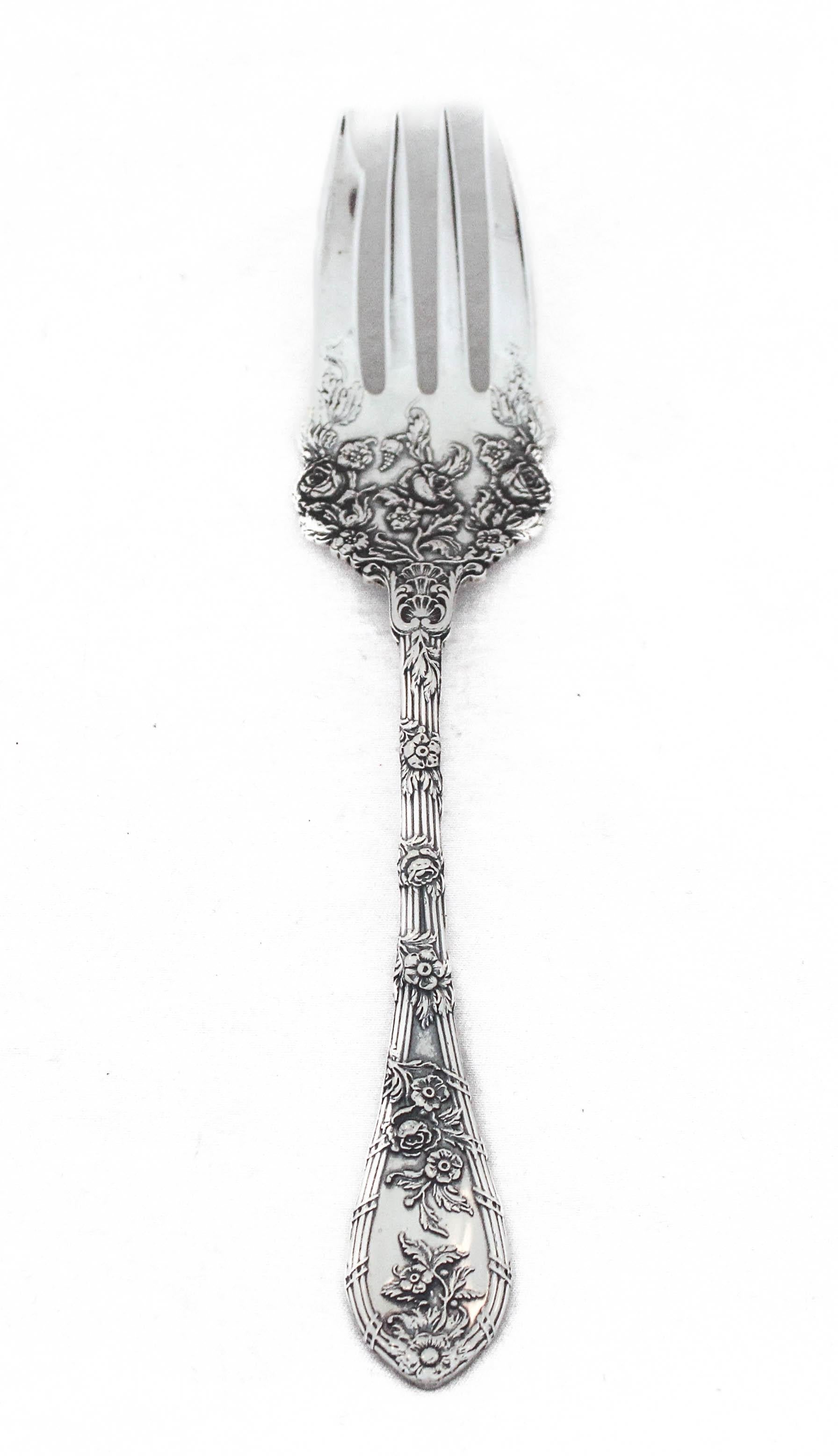Being offered is a sterling silver flatware set by William Durgin Silver.  This is a service for 12: 5 pieces per setting, 60 pieces total. 
The craftsmanship and design on this pattern is simply stunning.  Raised flowers wrap around each handle