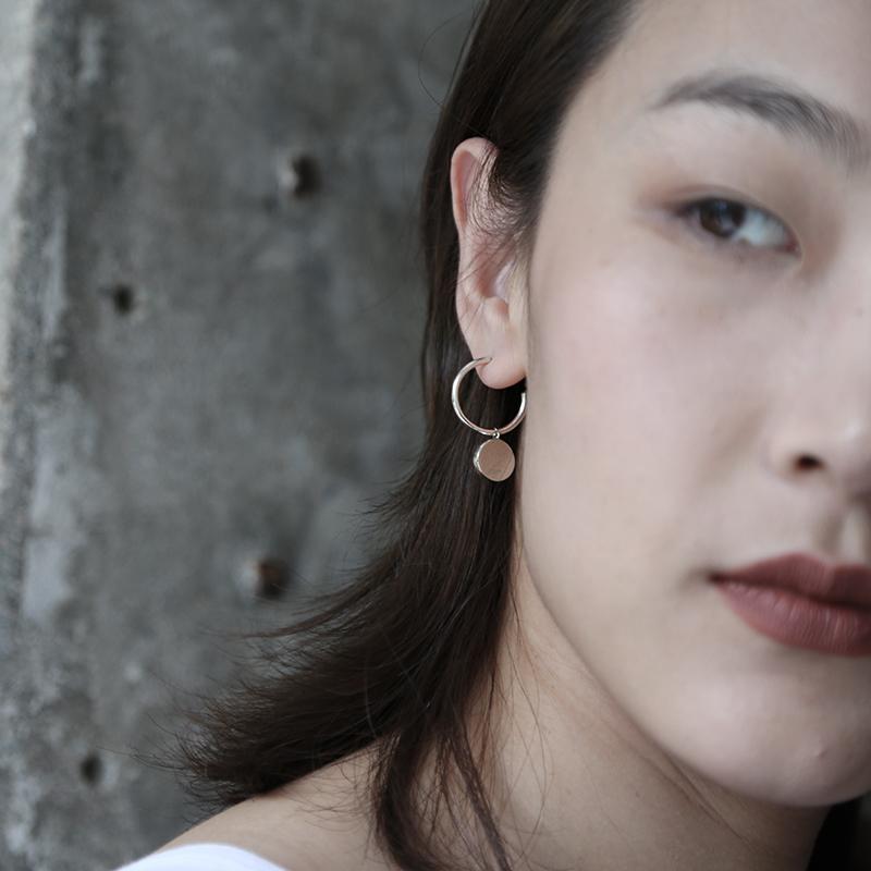 Mistova's Flip Earrings are a playfull classic. The movable disc shape on the earrings adds a tough of whimsey and playfulness. Made from highest quality sterling silver, available in gold and silver.