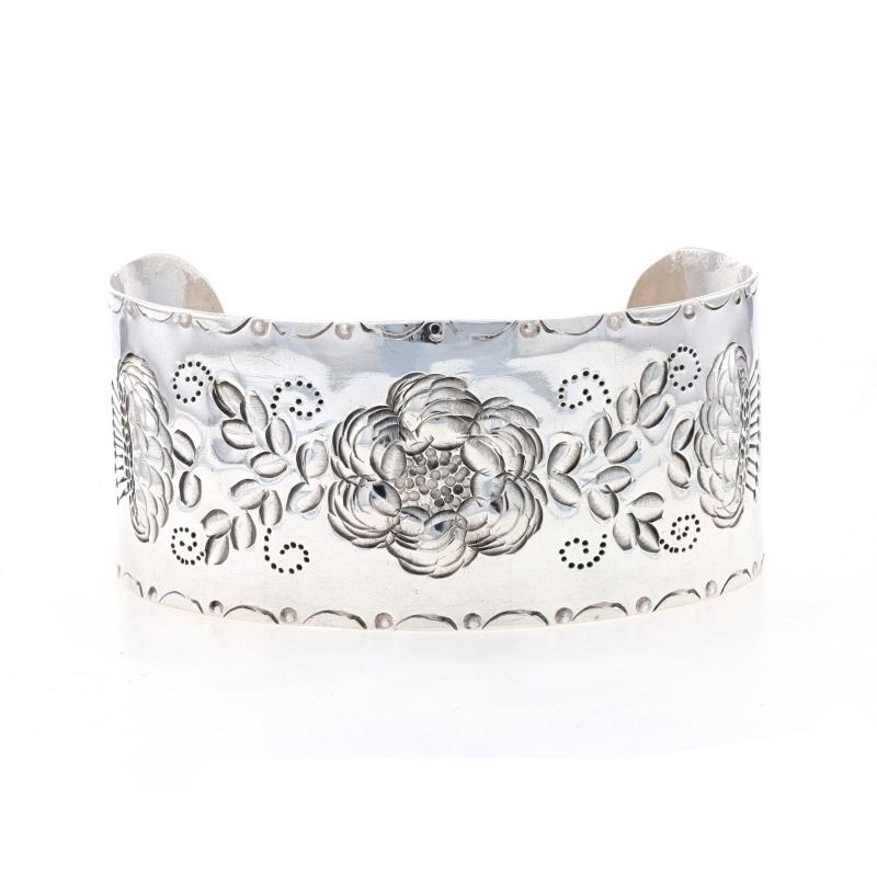 Design: Handmade

Metal Content: 925 Sterling Silver

Style: Cuff 
Fastening Type: N/A (slides over wrist)
Theme: Flower Garland, Botanical

Measurements

Inner circumference (including the opening): 7 1/2