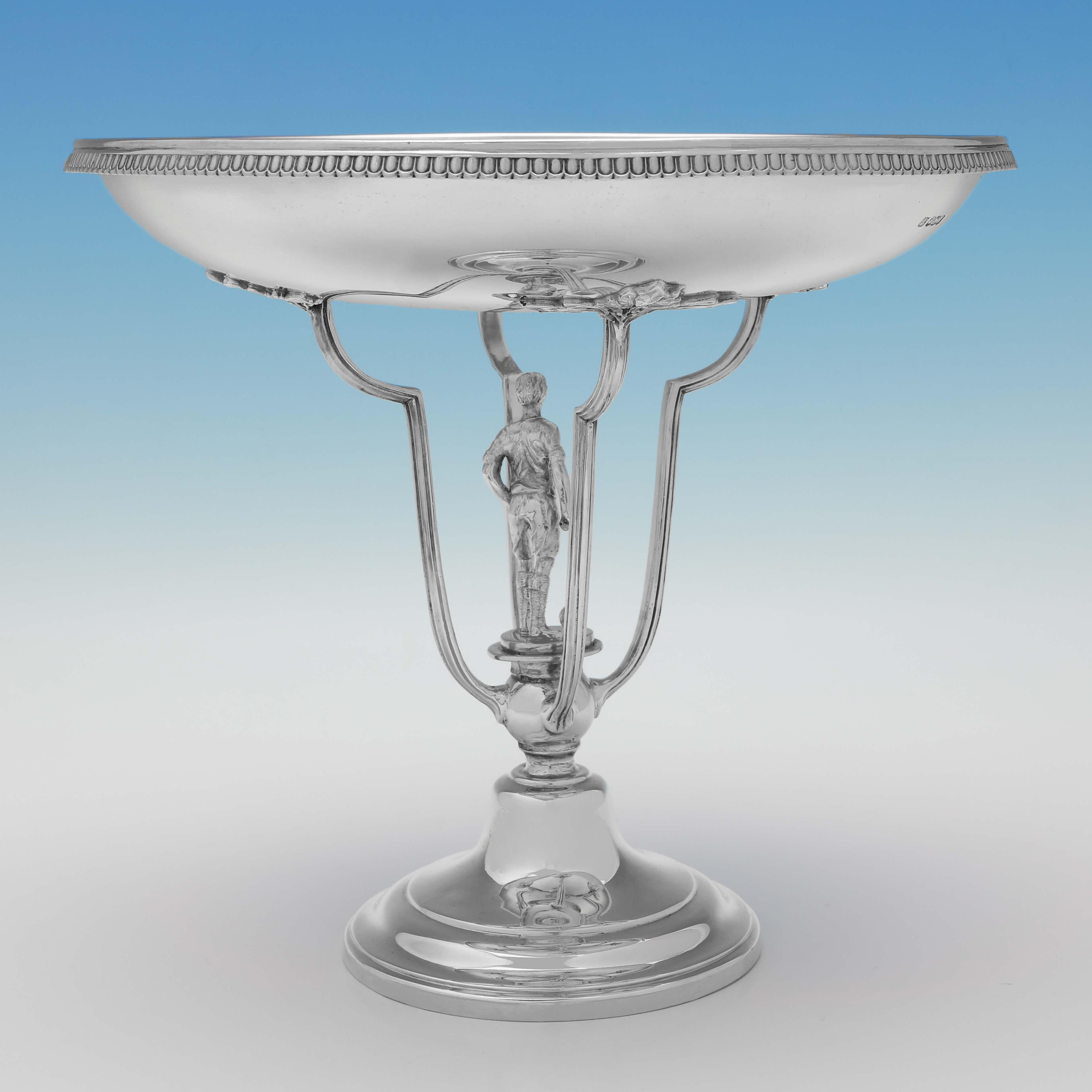 Hallmarked in Sheffield in 1927 by John & William Deakin, this handsome, Sterling Silver Football Trophy, is in the Art Deco taste, and features a cast model of a footballer under the dish. The trophy measures 8.5