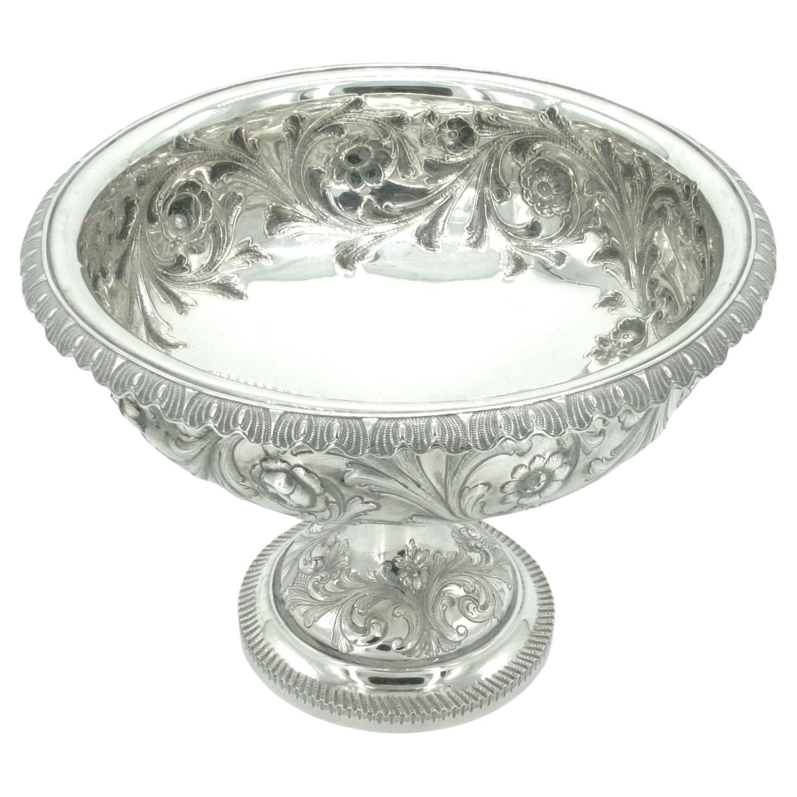 19th Century Sterling Silver tableware serving footed bowl with Exterior floral design details resting on a proportions round footed base. The serving bowl is in great antique condition. Minor wear appropriate to age / use. Marked Bailey & Co ( Lion