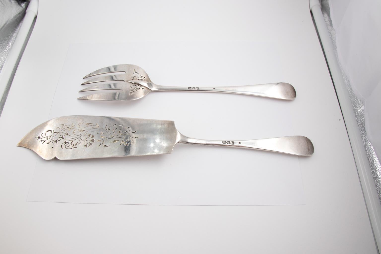 London Francis Higgins III two piece dish set with a matching knife and fork featuring etched floral designs, circa 1896. The knife measures 13.00 inches height and 2.50 inches wide; the fork measures 10.50 inches height by 2.25 inches wide. The
