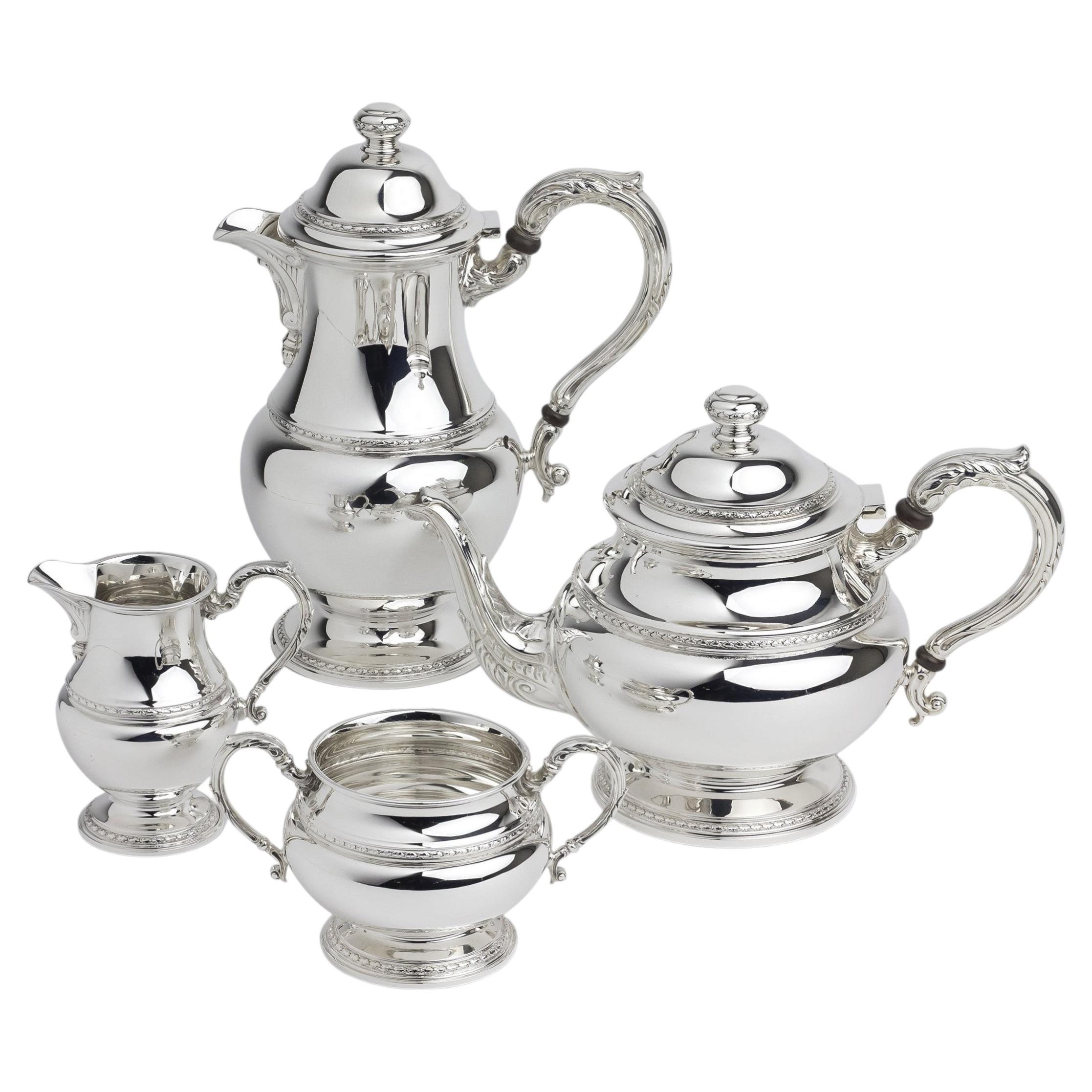 Sterling Silver Four Piece Tea Set by Goldsmiths and Silversmiths Co. For Sale