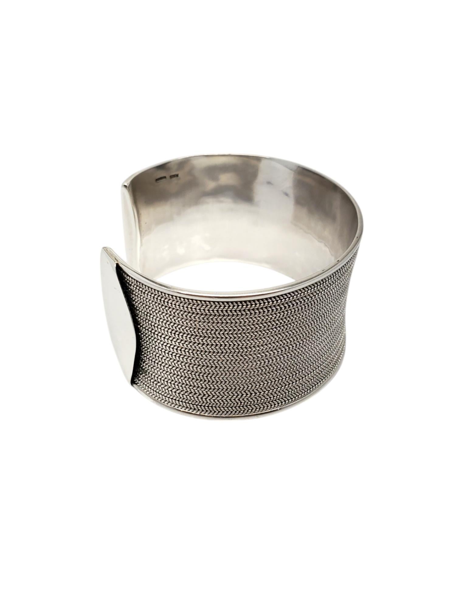 Sterling Silver Foxtail & Celtic Braid Wide Cuff Bracelet -

This stunning heavy cuff bracelet features a foxtail & celtic design in classic sterling silver.

Size: fits up to 6.75