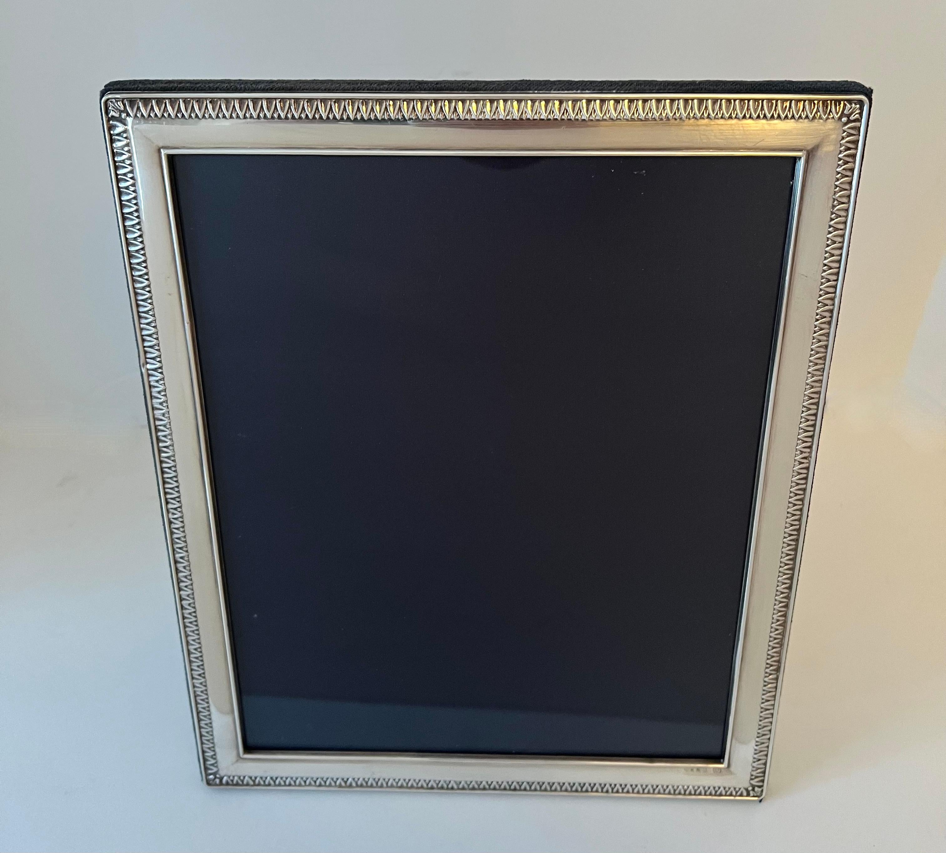 A wonderful sterling silver Frame, stamped and marked sterling 925 on the front lower portion. A wonderful wedding gift, housewarming or birthday gift... a Ralph Lauren edging makes this piece, not only a piece to remember, but works well in many