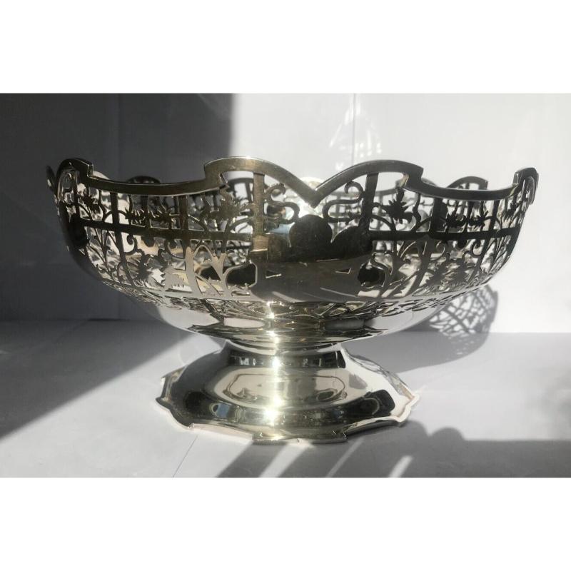 In good vintage condition, this is an elegant, sterling silver pedestal dish. It is decorated with delicate openwork of flourishing flowers and leaves. 

It would look lovely on any table or make a perfect gift.

Additional Information: 
Hallmarked: