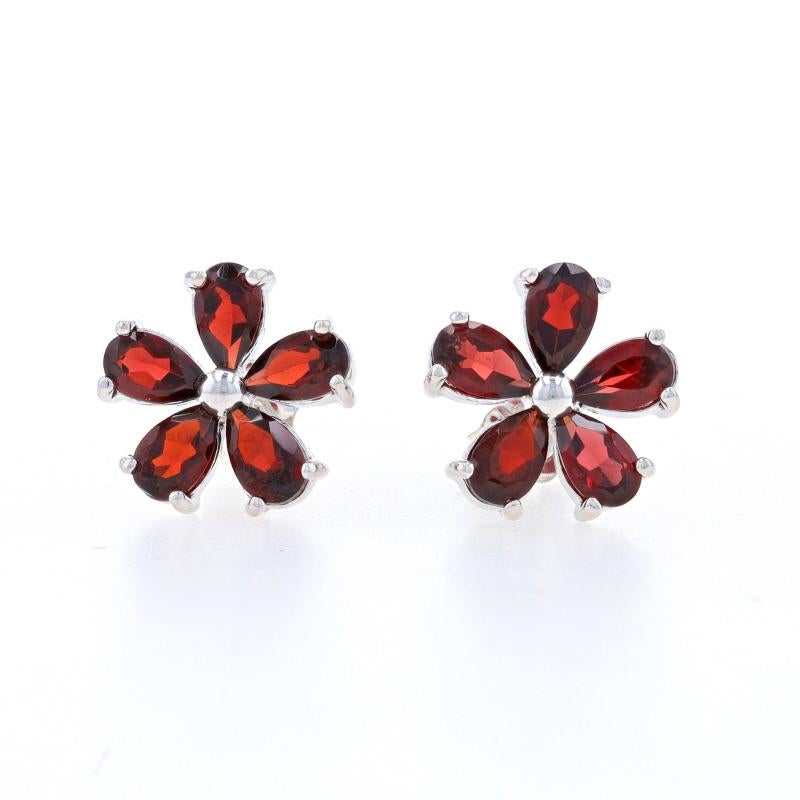 Metal Content: Sterling Silver

Stone Information
Natural Garnets
Carat(s): 2.50ctw
Cut: Pear
Color: Red

Total Carats: 2.50ctw

Style: Large Stud
Fastening Type: Butterfly Closures
Theme: Flower Blossoms

Measurements
Tall: 7/16