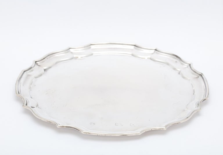 Sterling silver salver/tray, in the George III style, London, year-hallmarked for 1987, Pinder Bros. - makers. Measures 8 1/4 inches diameter x slightly less than 1/2 inches high. Weighs 8.095 troy ounces. Dark areas on sterling silver in photos are