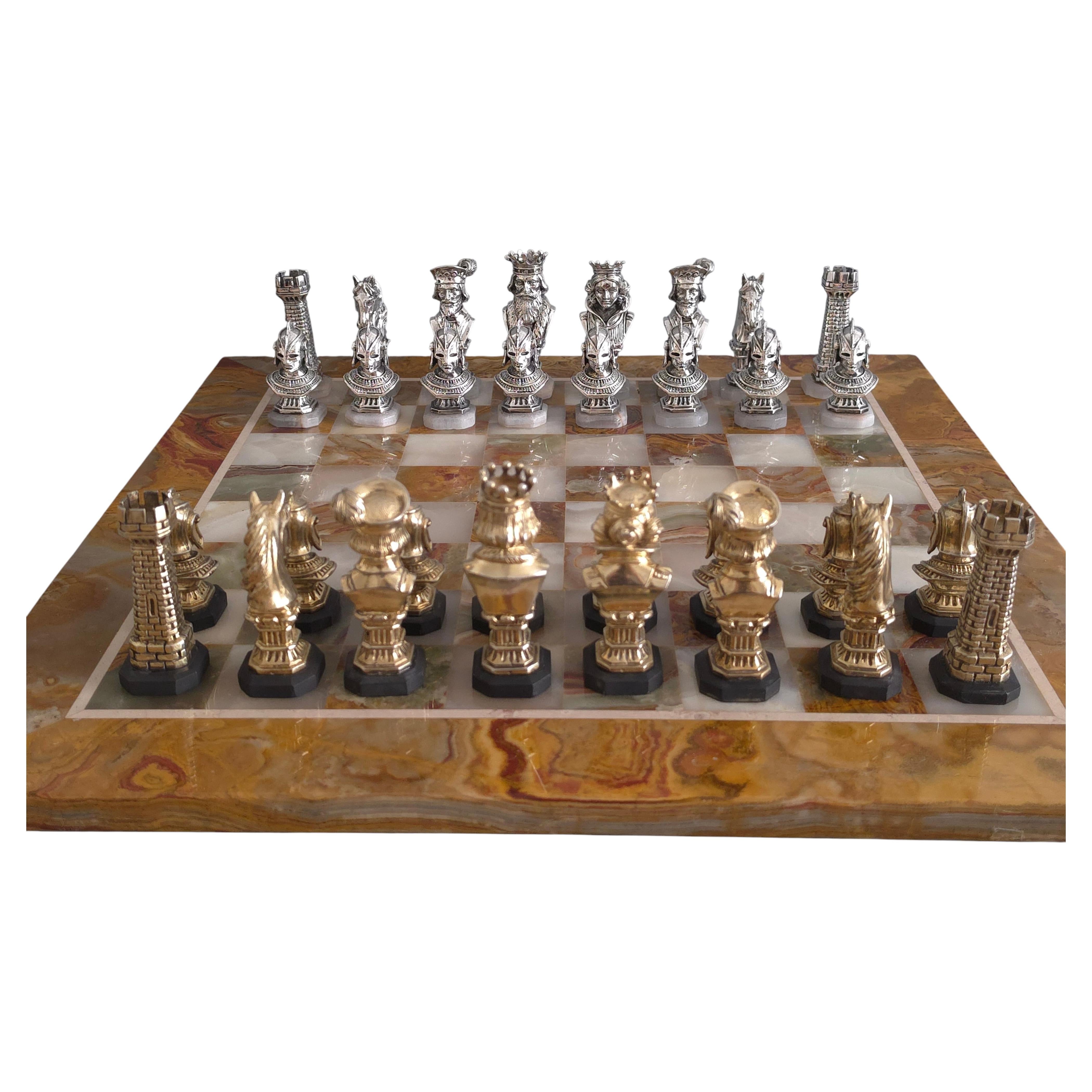 Silver, gilt and onyx chess set with board