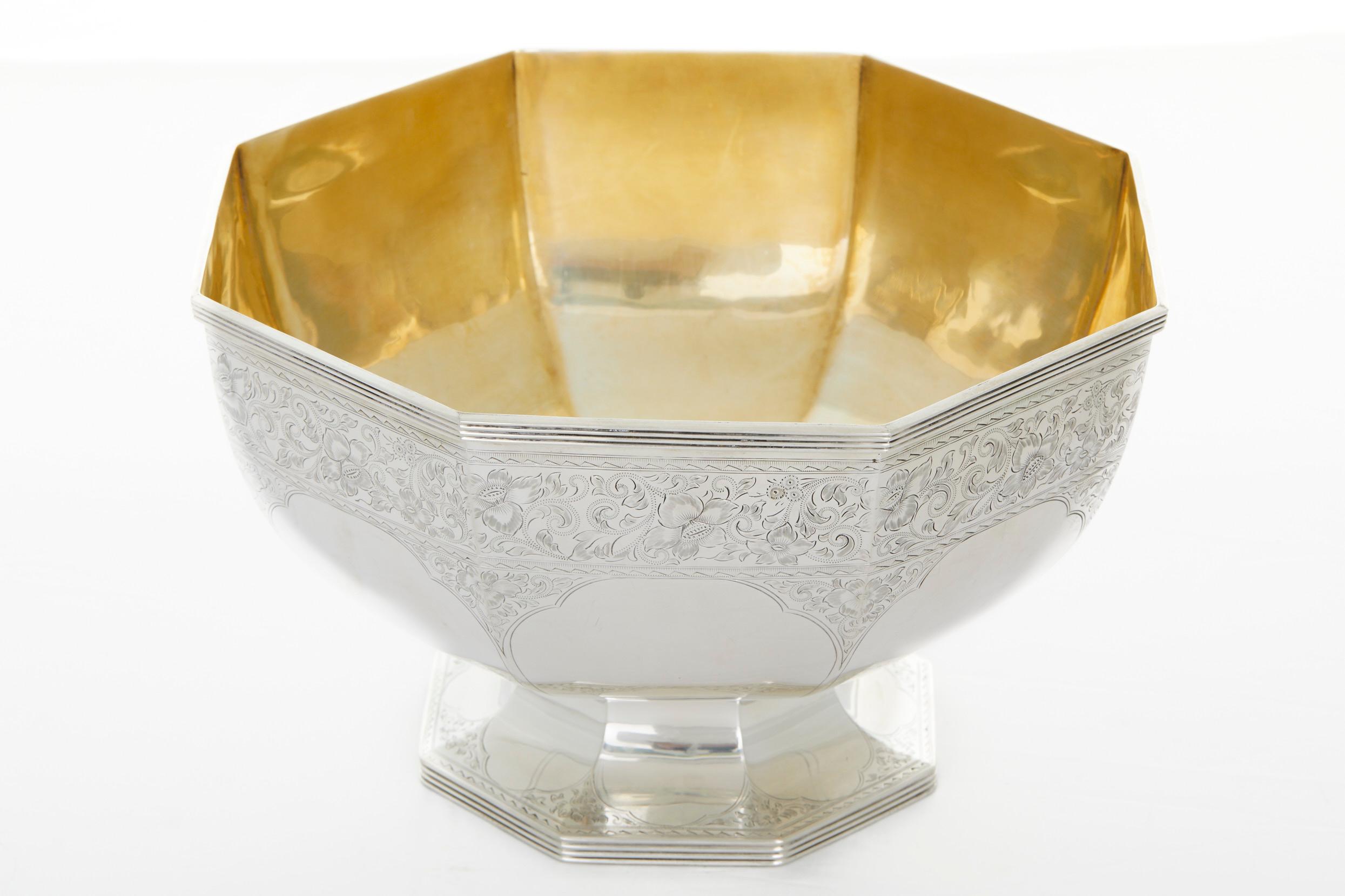 Late 19th century sterling silver footed centerpiece bowl with exterior floral band design details and gold wash interior. The centerpiece bowl is in great antique condition. Minor wear consistent with age / use. Maker's mark and numbered
