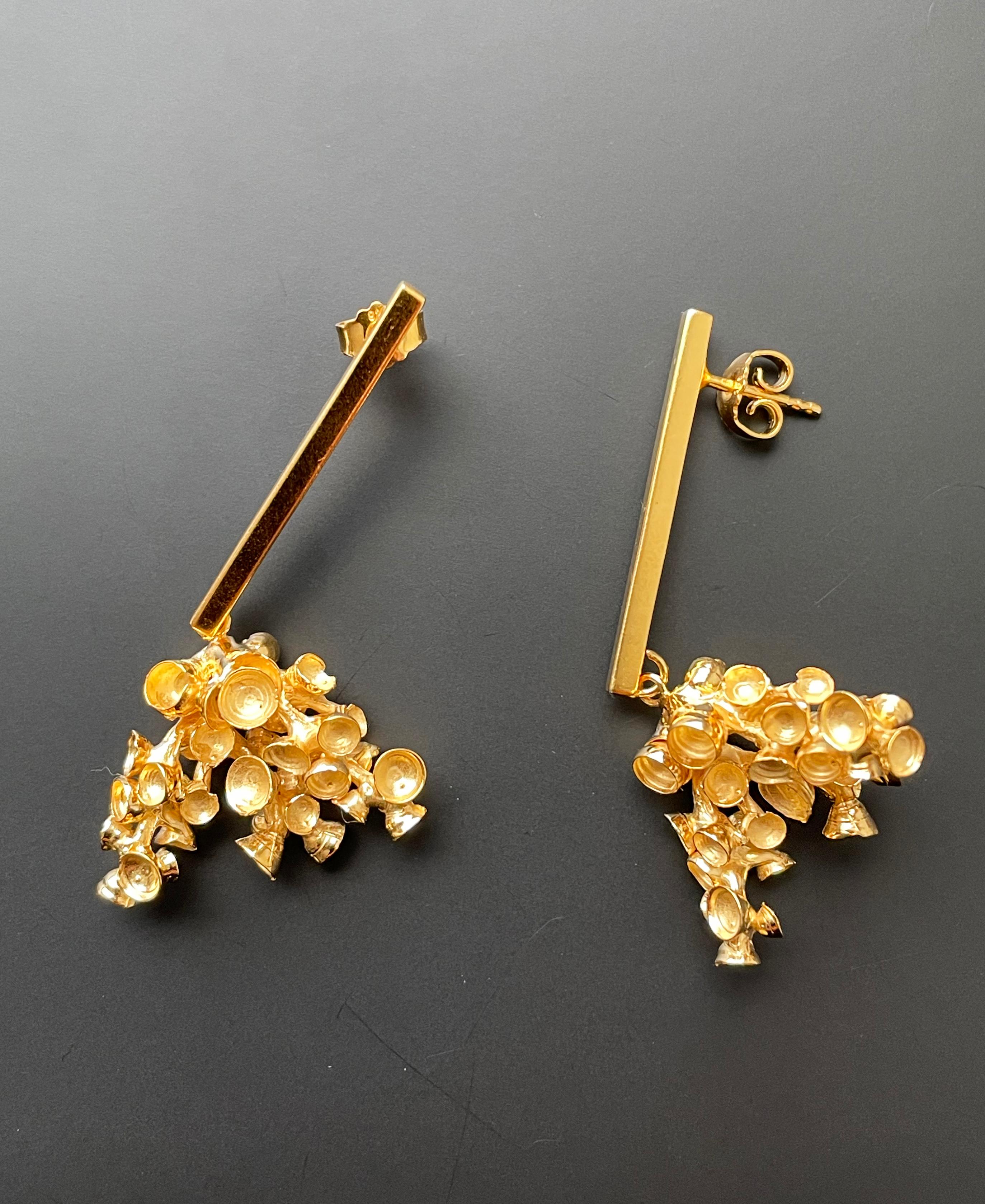Unique, beautifully designed silver-gilt earrings fascinate with their attractive shape reminiscent of spectacular corals.
 
This handcrafted jewelry is not only an elegant and inspiring detail of the style, but it also gives pleasant confidence and