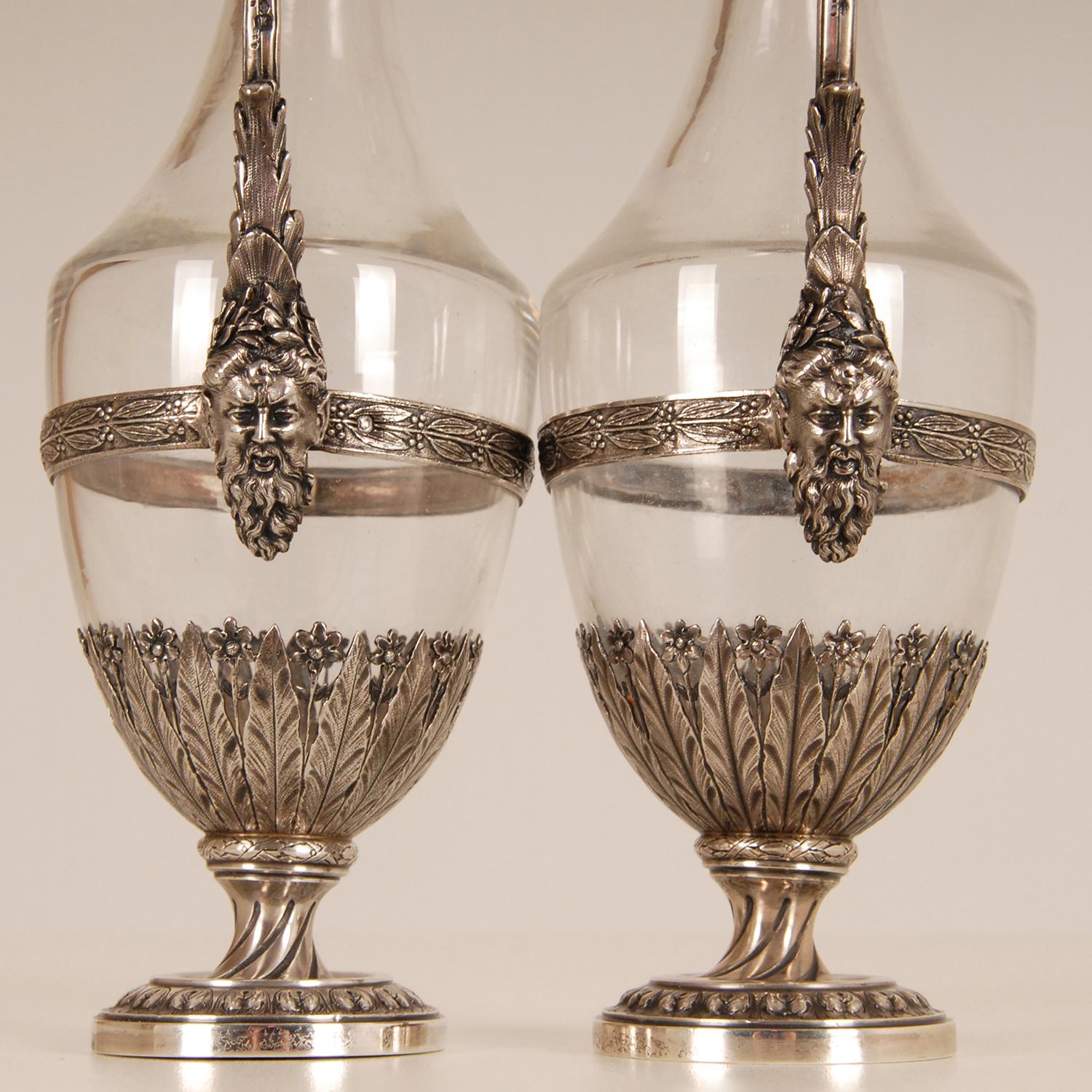 A pair of antique sterling silver and glass decanters 
Style: Louis XVI, Neoclassical, Victorian, French, 19th century, Antique, Georgian
Origin France, Paris, 1880
A pair sterling silver and glass decanters. Fully handcrafted decorative tableware