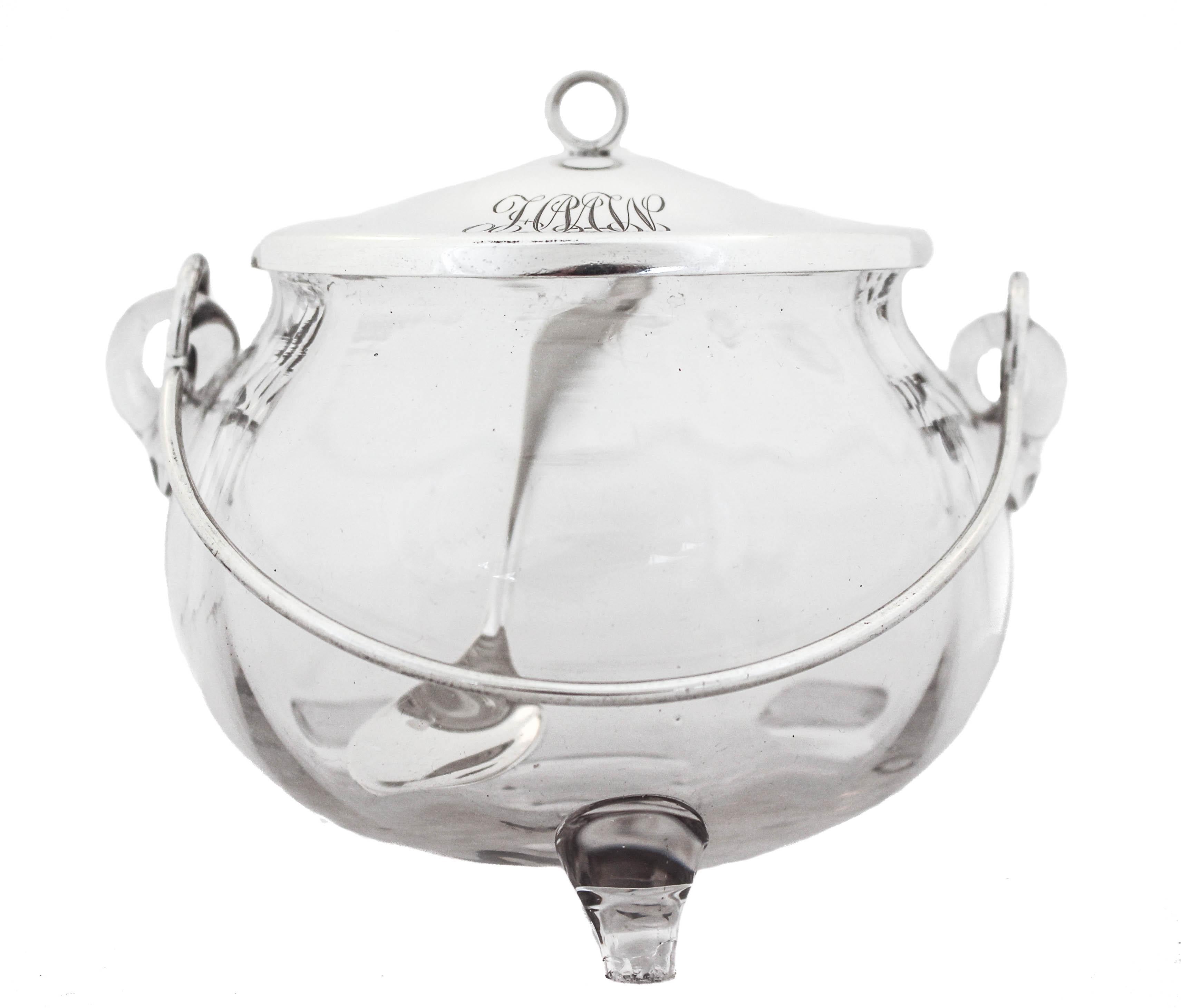 Being offered is a sterling silver and glass jar with a silver spoon.  The lid, spoon and handle are sterling silver and the jar is glass.  Perfect for jam, or any condiments because the glass is so easy to clean and nothing you put inside will