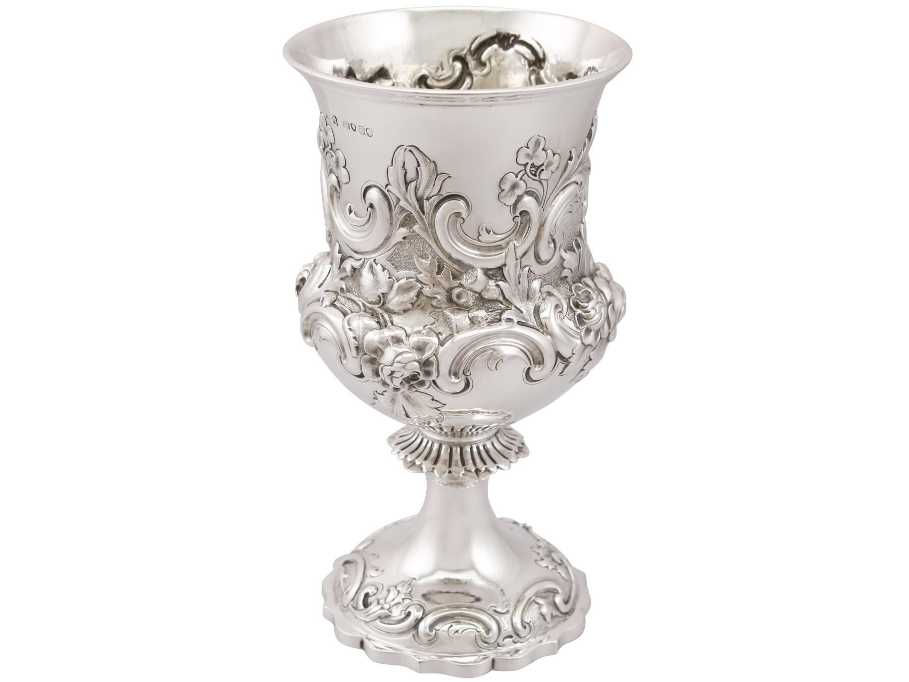 An exceptional, fine and impressive antique Victorian English sterling silver goblet; an addition to our collection of wine and drinks related silverware.

This exceptional antique Victorian sterling silver wine goblet has a circular Campania