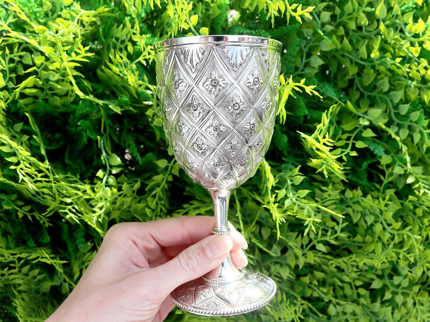 This exceptional antique Victorian sterling silver goblet has a circular bell shaped form onto a knopped pedestal and circular spreading foot, in the Classic pineapple style.

The body of this impressive 19th century wine goblet is composed of