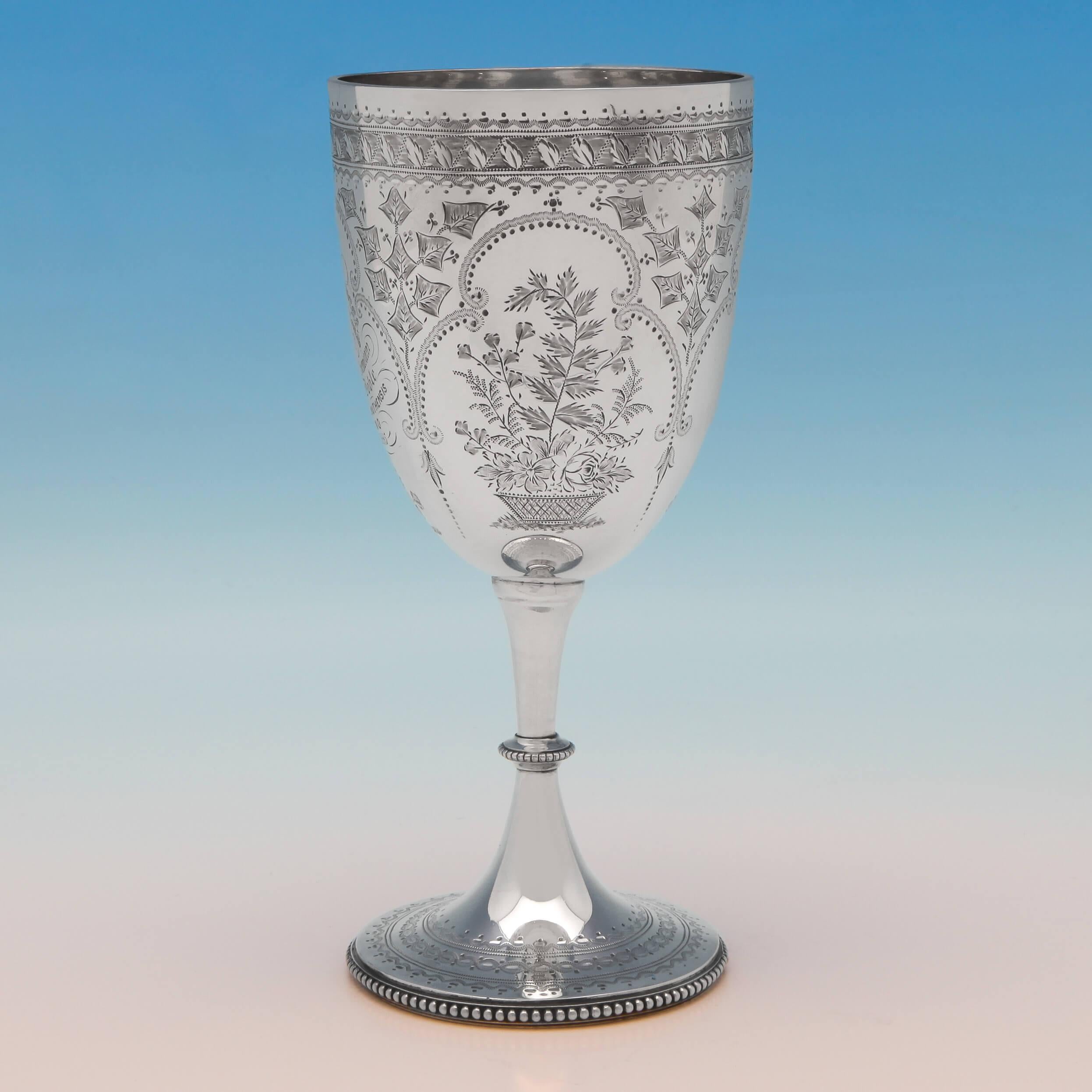 Hallmarked in London in 1874 by Elkington & Co., this, very attractive, Victorian, antique, sterling silver goblet, features naturalistic engraving, bead borders, and an original engraved inscription which reads “Rev. I. H. P. Bennett M. A. - Corp