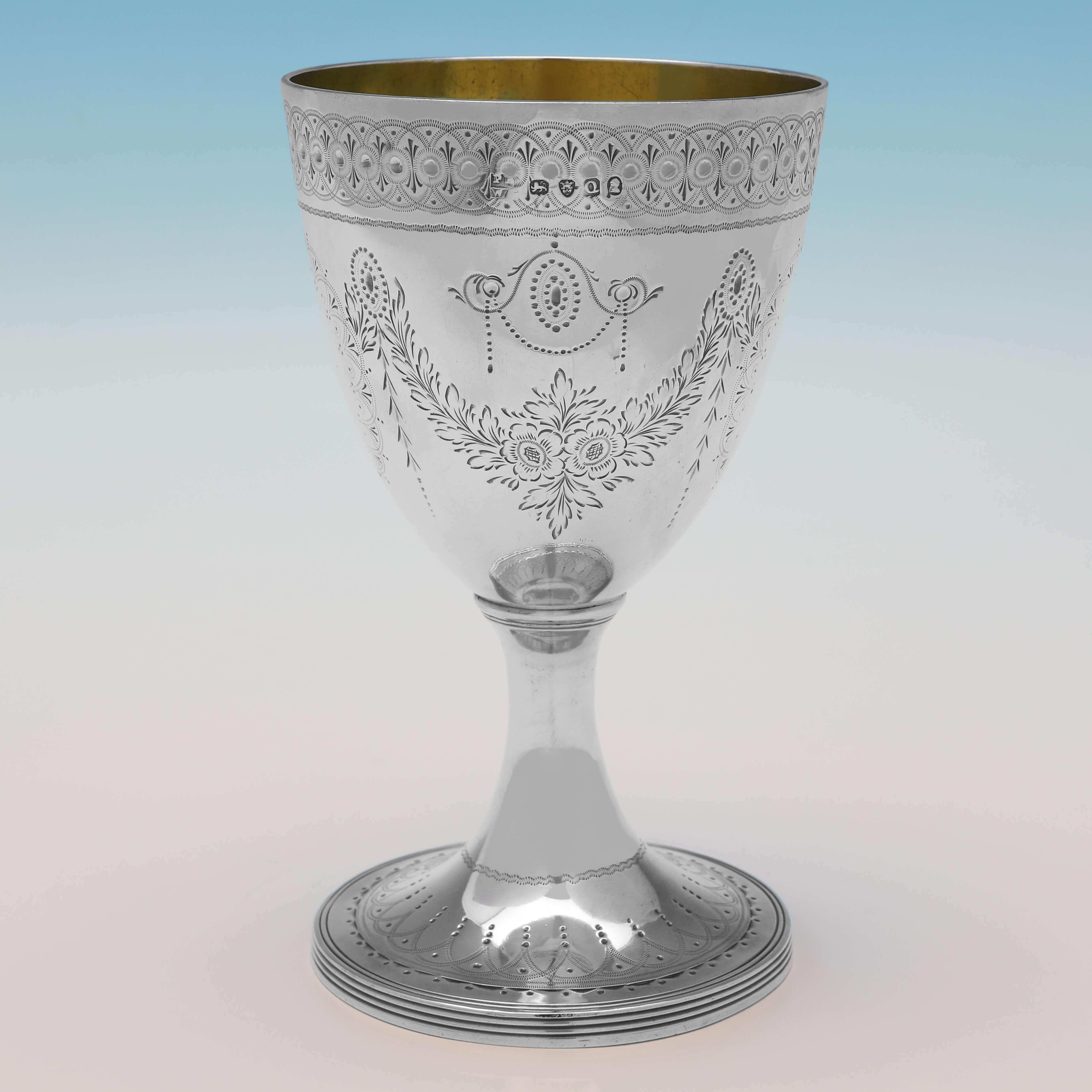 Hallmarked in London in 1811 by Peter & William Bateman, this stunning, Antique Sterling Silver Goblet, is in the neoclassical taste, featuring brightcut engraved decoration throughout, and a gilt interior. The goblet measures 5.75