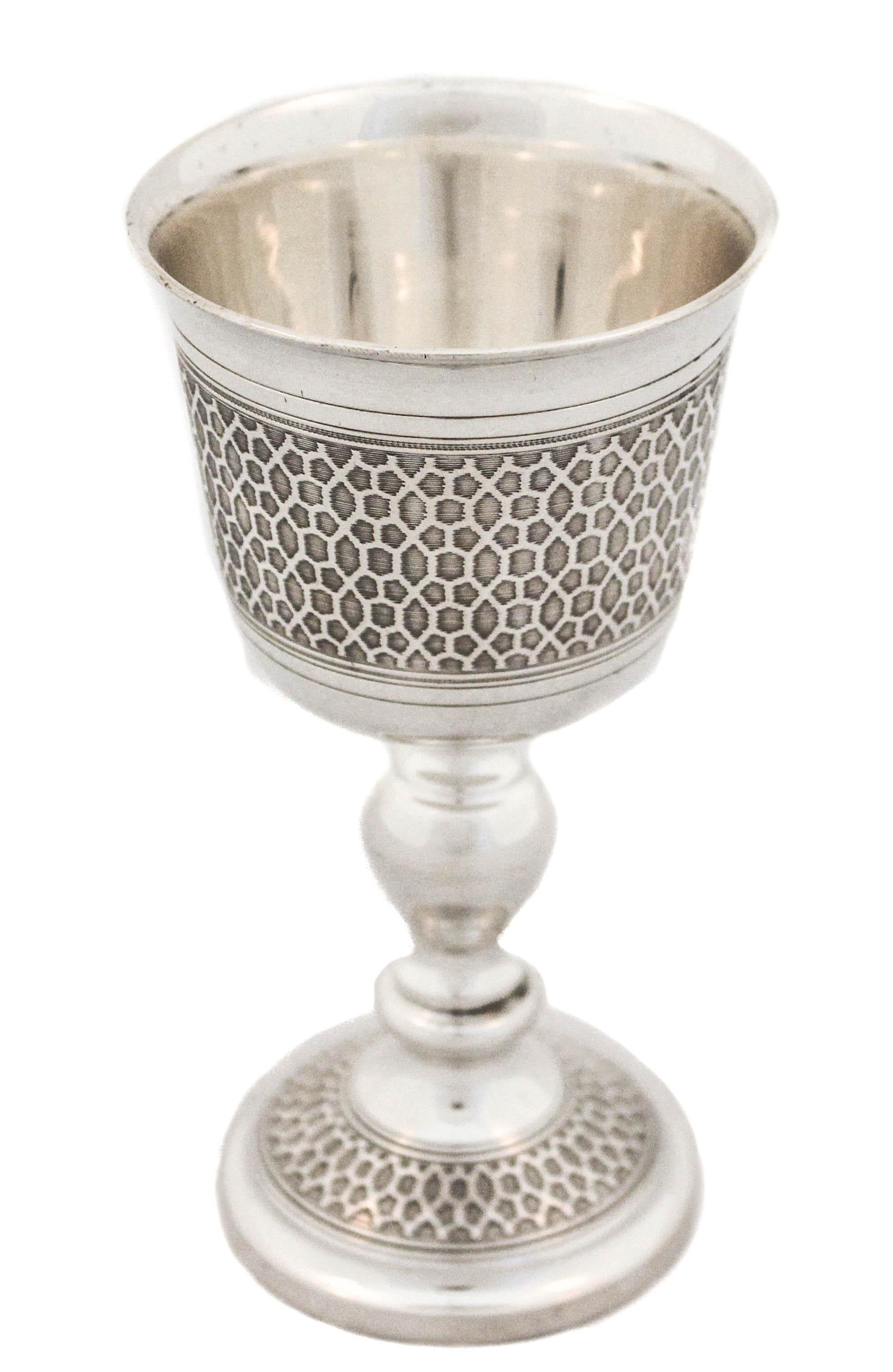 This sterling silver goblet is very unique.  Very few were made at the time and rarely come on the market.  There is a symmetrical pattern around the body and base that is reminiscent of Middle Eastern tile or ceiling designs.  It gives the cup a