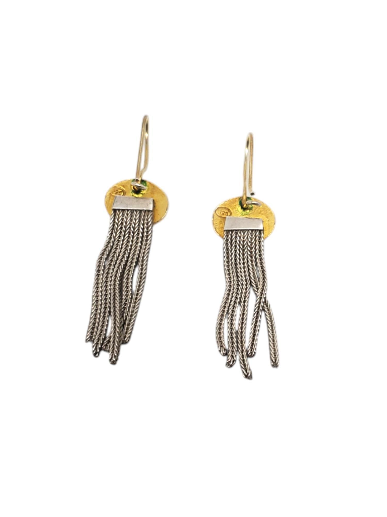Sterling Silver & Gold Vermeil Multi Strand Foxtail Earrings -

These vintage multi strand earrings features a gold vermeil & black enamel station with 4 hanging foxtail chains in sterling silver.
Matching necklace # 20654
bracelet # 20653

Size: 2