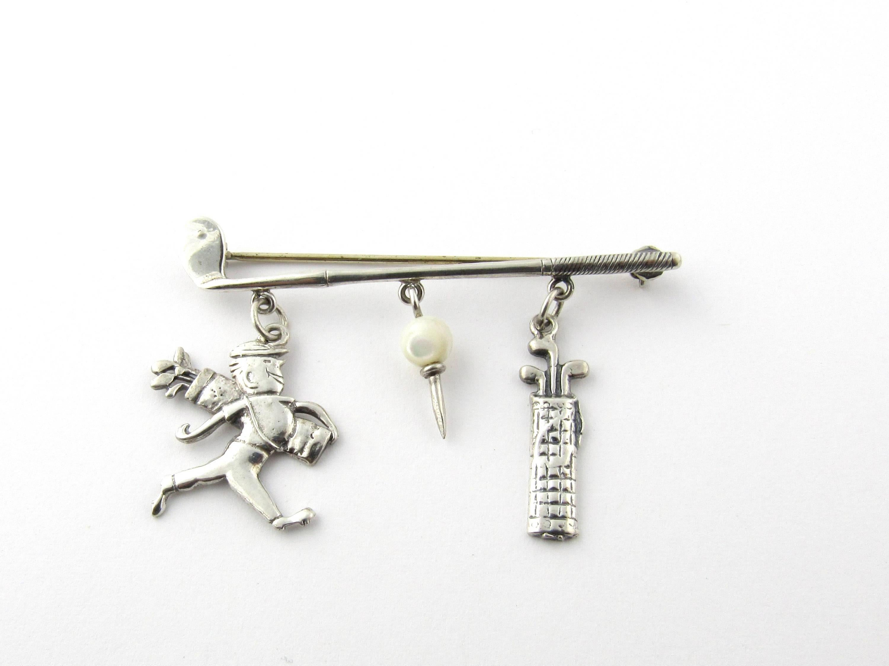 Vintage Sterling Silver Golf Brooch
A must for the avid golfer! 
This whimsical pin features a golf club with golf bag, caddy and golf ball dangling from it. 
Size: 53 mm x 23 mm 
Weight: 3.6 dwt. / 5.7 gr. 
Hallmark: Sterling 
Very good condition,