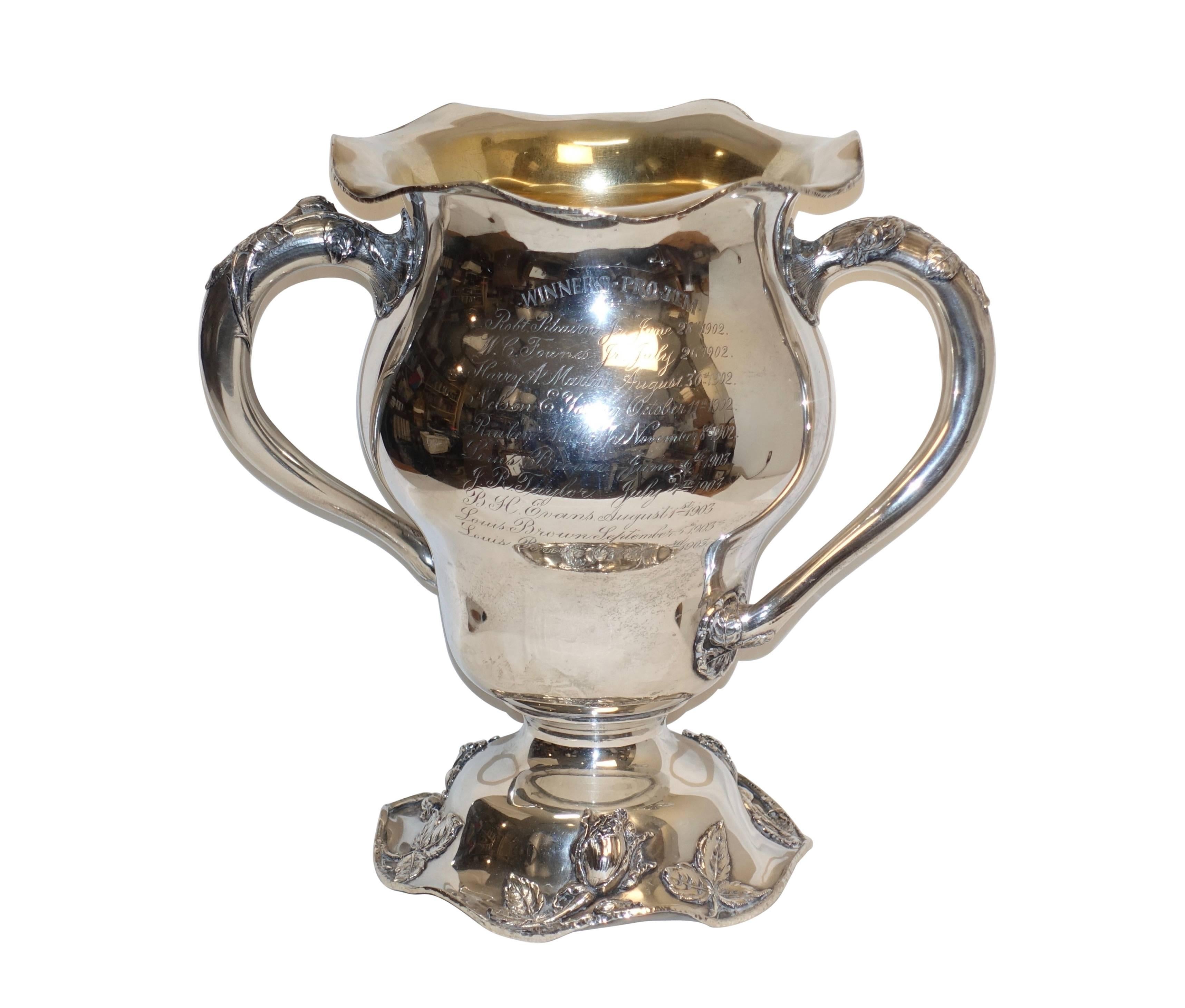 A large sterling silver trophy for Pittsburgh, Hotel Country Club. Schenley golf cup won by Boris Brown, the reverse side engraved with winners pro tem 1902 and 1903. Having a gold wash interior and marked on the underside with an ‘M’ above a leaf