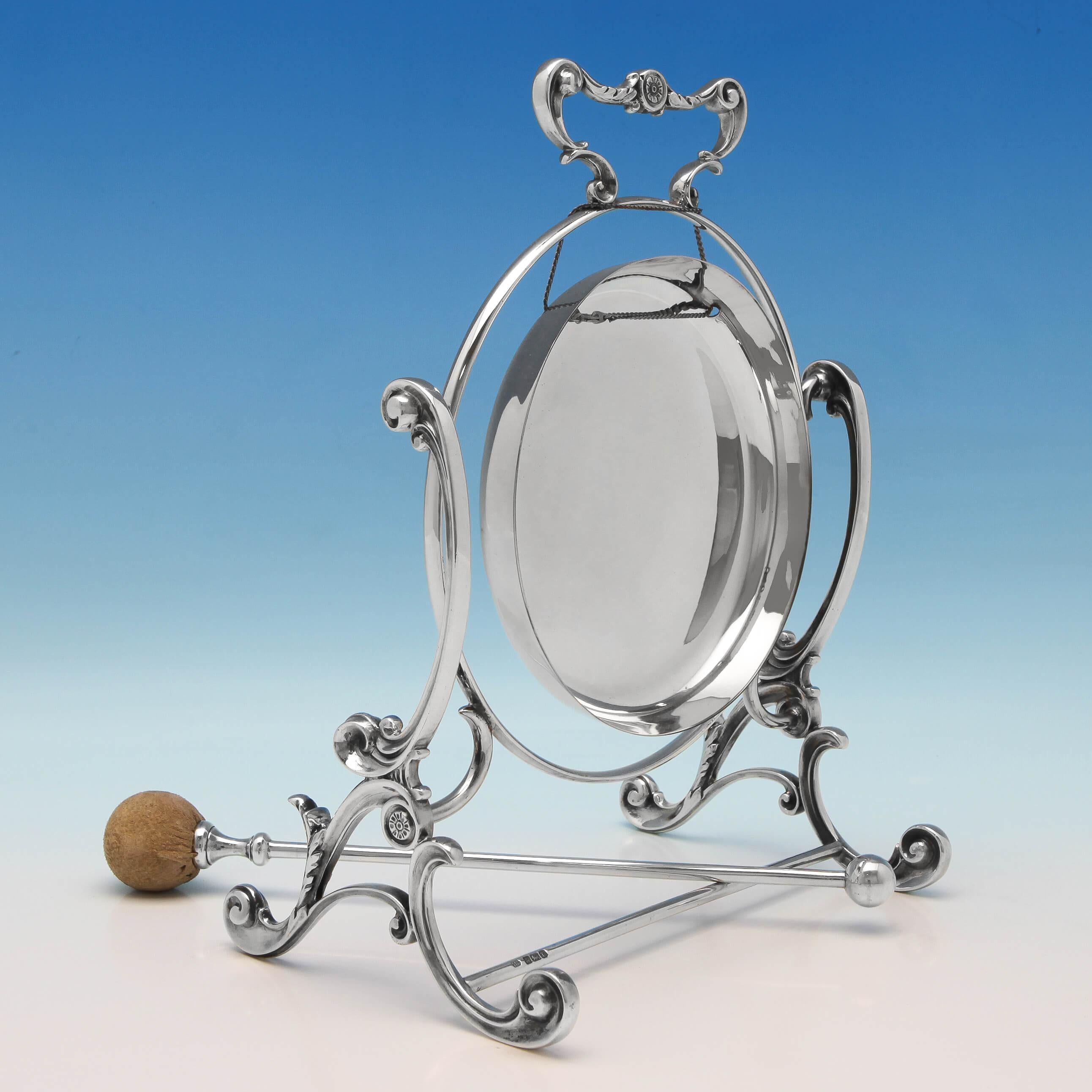 Hallmarked in Sheffield in 1909 by Fenton Brothers Ltd., this stylish and rare, Edwardian, Antique, Sterling Silver Gong stands on a scroll detailed frame and has a beater with chamois leather cover. The gong measures 10