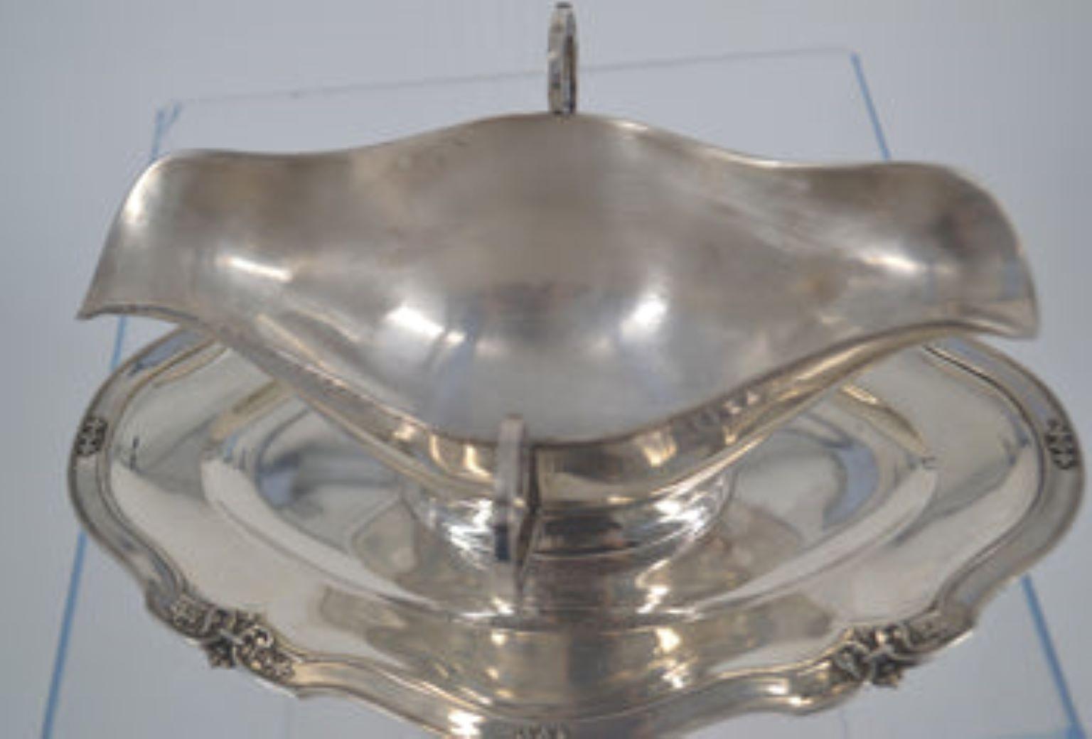 Sterling silver gravy/sauce boat, with attached tray.