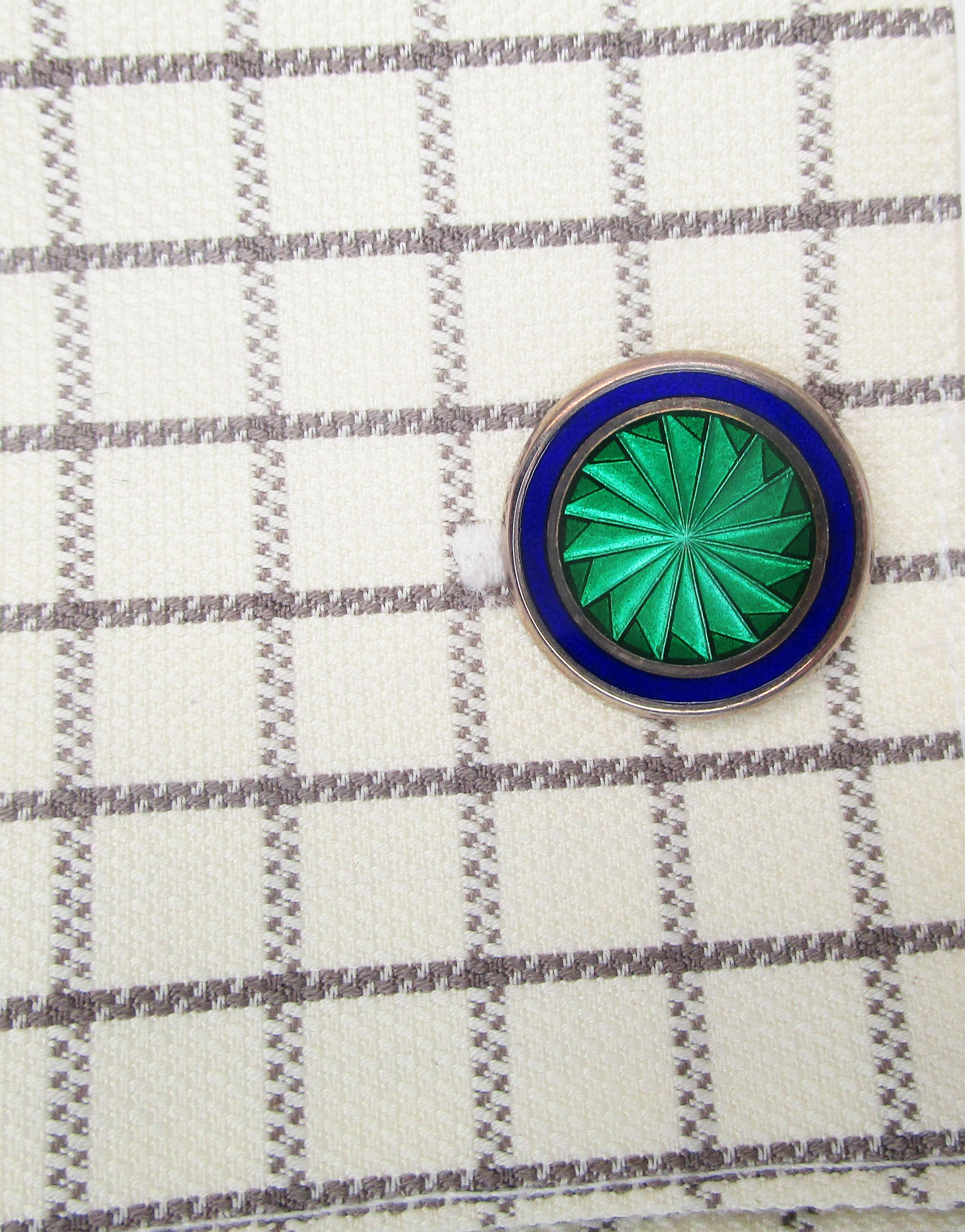 This is an excellent pair of large scale English cufflinks in sterling silver with a great blue and green design! The panels of these links feature a bright blue border and a subtly detailed green spiral center! The color scheme gives these links a