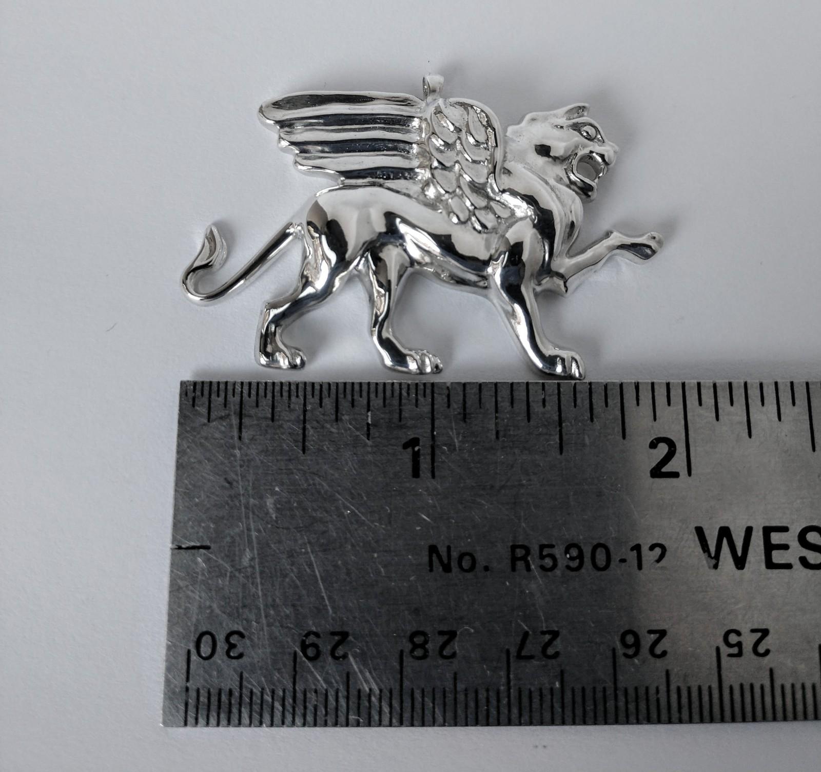 Sterling Silver Griffin  Pendant Necklace for men 2 inch .  Tiffany designer , Thomas Kurilla created this for 1st dibs exclusively. Sculpture is my passion. This lion griffin is getting ready to take on his enemy 4 teeth and all. 2 inch wide  high.