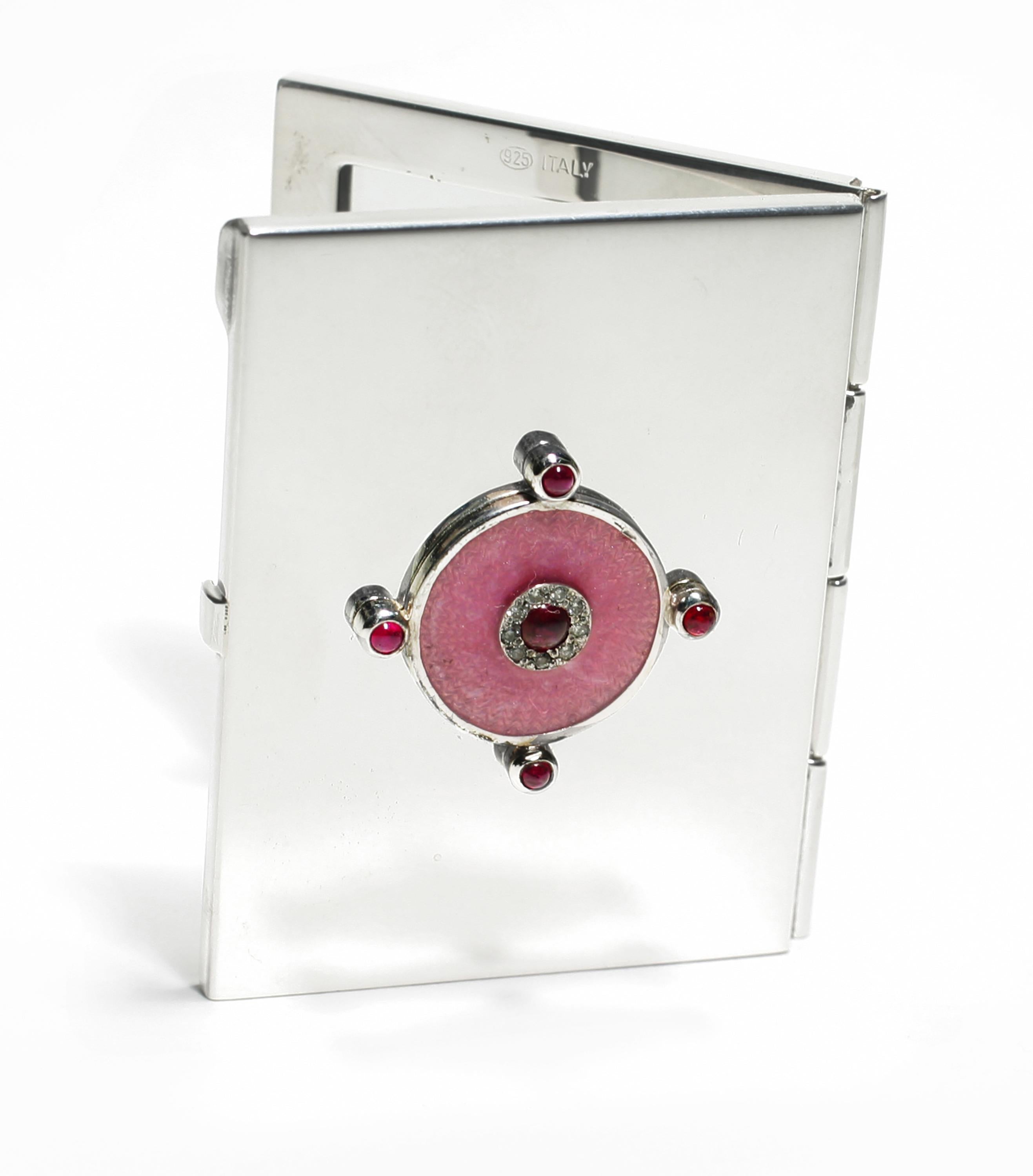 20th-century sterling silver Guilloché pink enamel mirror case
Cabochon rubies weighing 1.16 carats
Diamonds weighing 0.15 carats
Handmade in Italy
The Ocie Minaudiere collection was created to incorporate precious gemstones into evening luxury