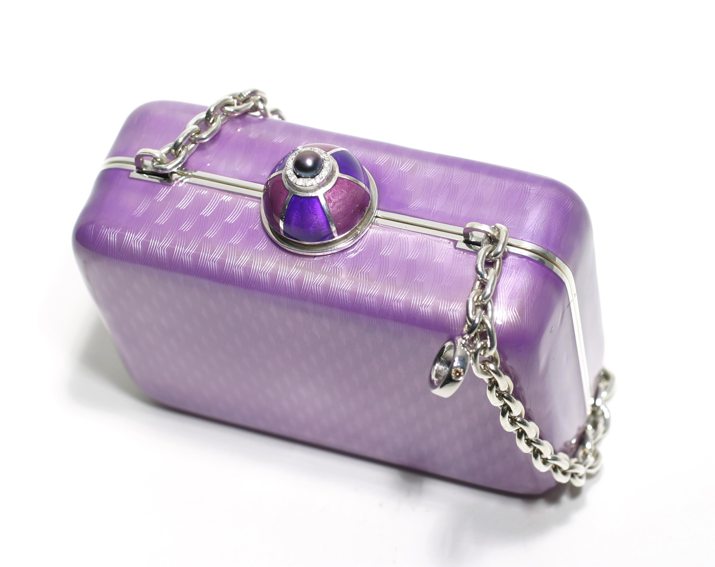 One of a kind, 20th-century sterling silver Guilloché purple enamel Minaudière 
Pave set with 0.30 carats of diamonds
Freshwater purple pearl
11