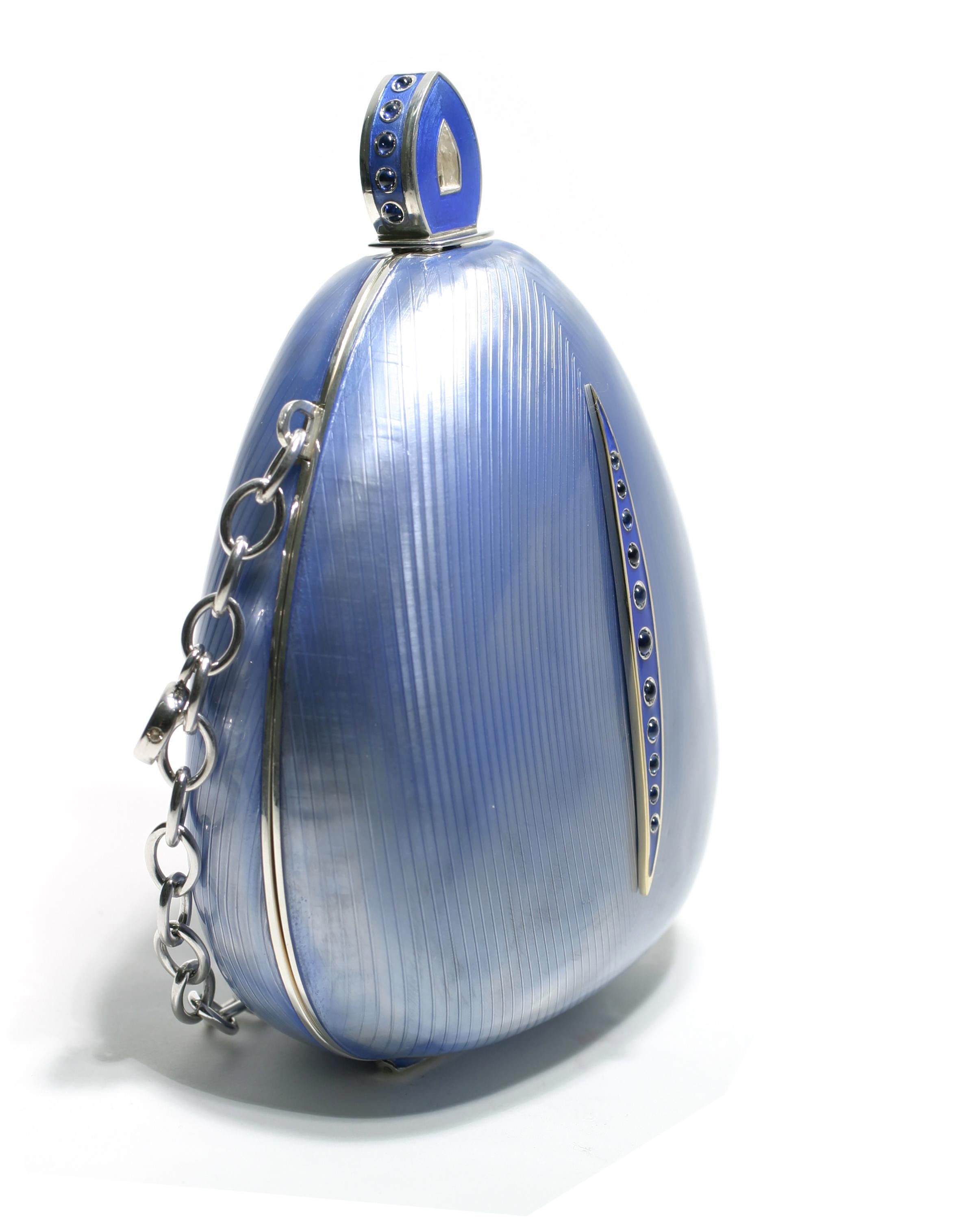 One of a kind, 20th-century sterling silver Guilloché blue enamel Minaudière
Cabochon sapphires weighing 4.55 carats
11