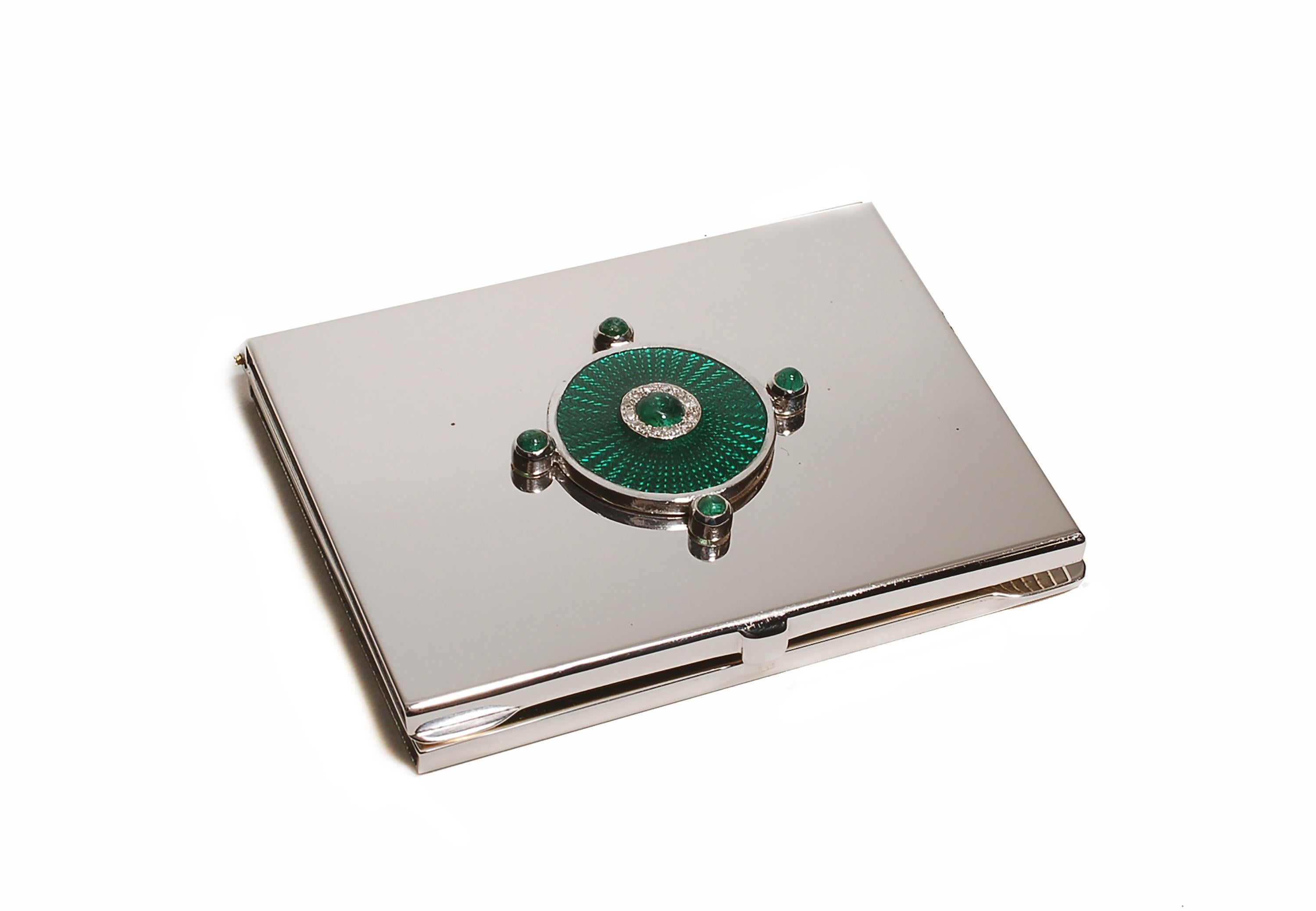 20th-century sterling silver Guilloché green enamel mirror case
One of a kind mirror case 
Cabochon emeralds weighing 0.65 carats
Diamonds weighing 0.15 carats
Handmade in Italy
White gold plated 
The Ocie Minaudiere collection was created to