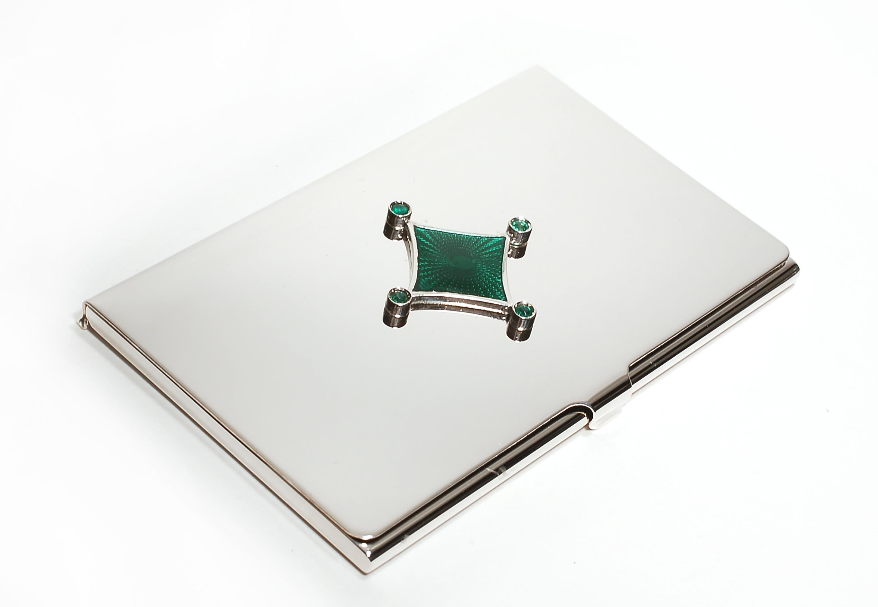 20th-century sterling silver Guilloché green enamel card case
Round emeralds weighing 0.45 carats
Handmade in Italy
White gold plated
The Ocie Minaudiere collection was created to incorporate precious gemstones into evening luxury Minaudière
Ocie's