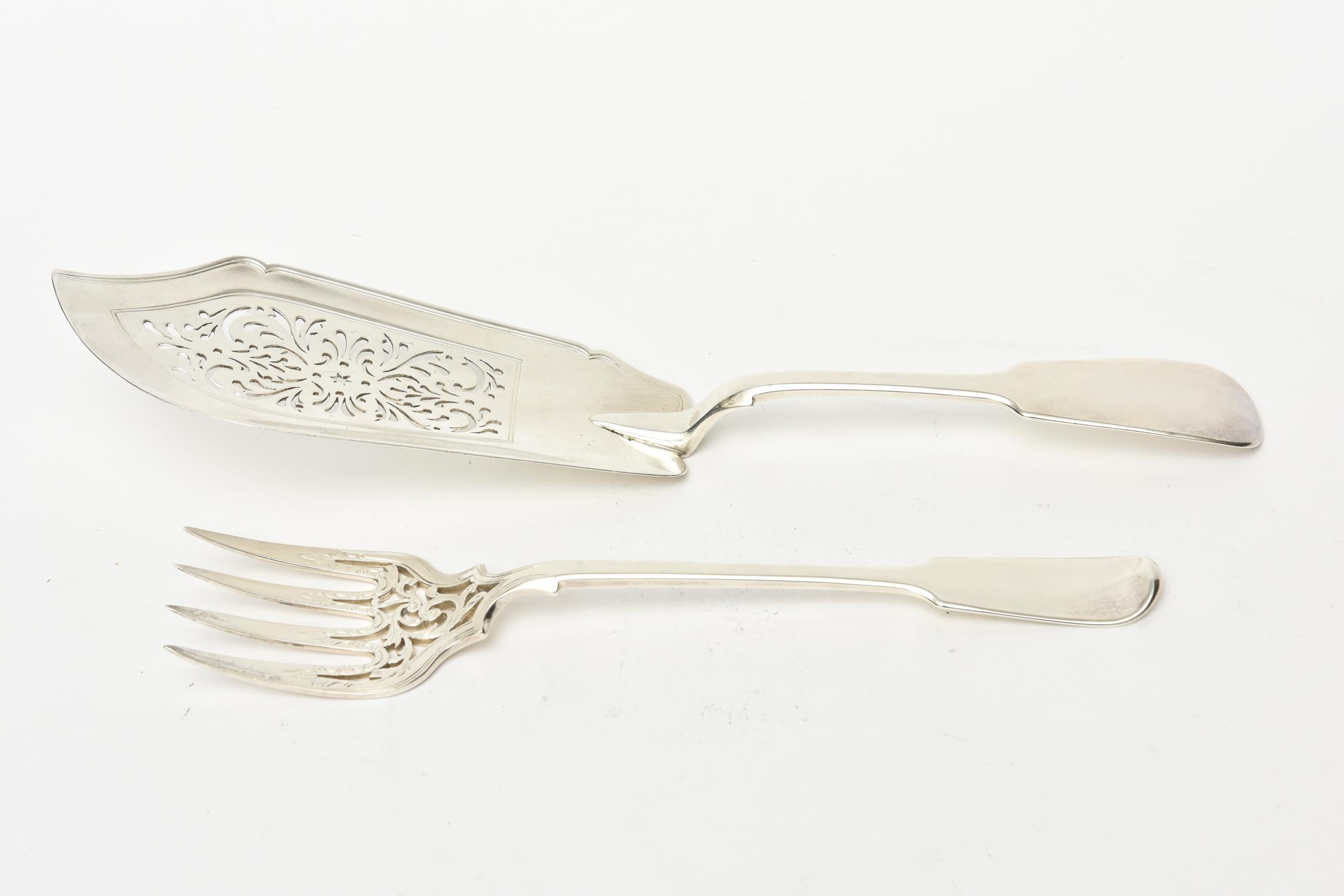 This early Victorian era sterling silver fish fork and knife serving set has multiple hallmarks. This is perfect for all your serving and entertaining needs in style and elegance. It is tooled with designs of early patterns. It does have the