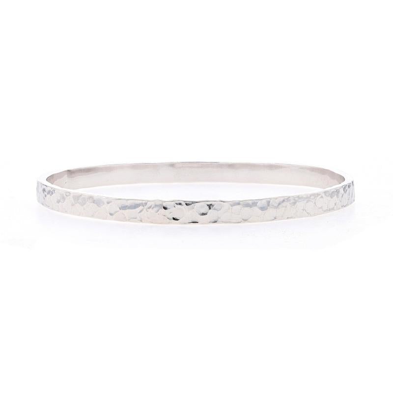 Metal Content: Sterling Silver

Style: Round Bangle
Fastening Type: N/A (slides over wrist)
Features: Hammered Exterior with Smoothly Finished Interior

Measurements

Inner Circumference: 8 1/2