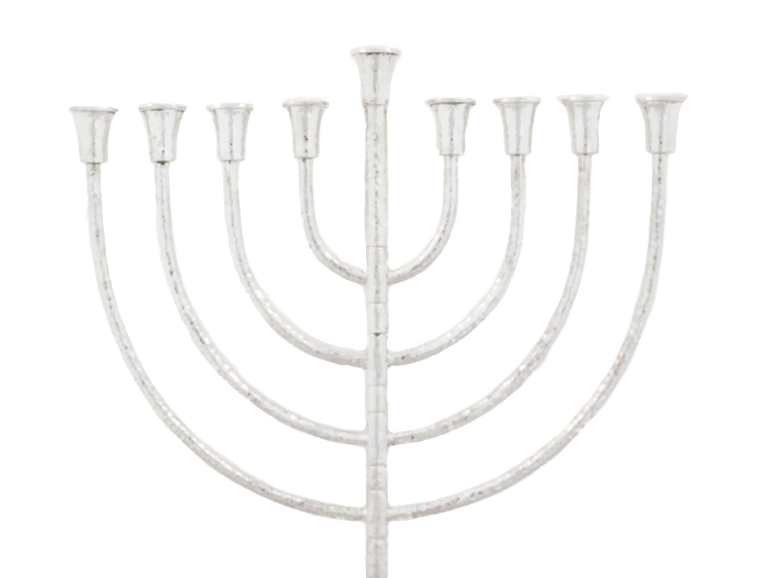 Being offered is a sterling silver hand hammered menorah.  It is modern but and has a classic and elegant shape and design. Each arm branches out from the center and is evenly spaced from the other arms. There’s an Art Deco style pattern along the