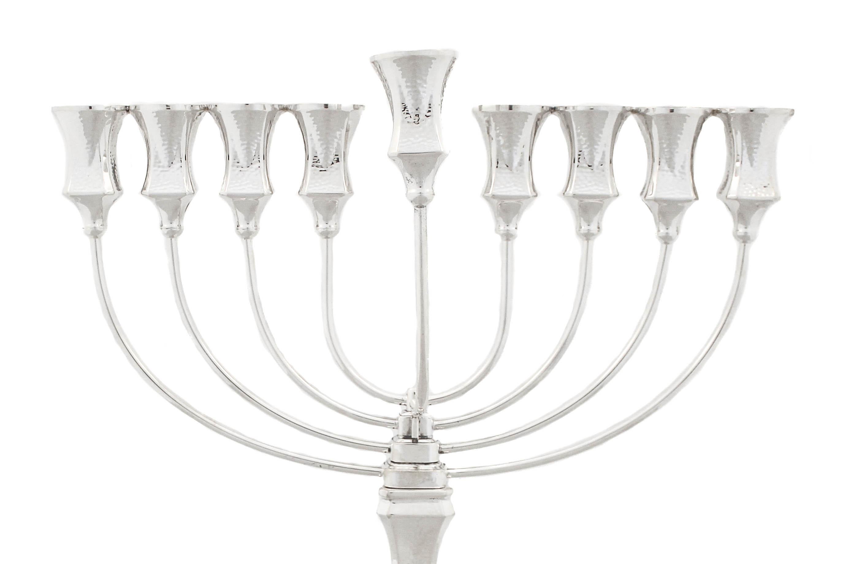 Being offered is a sterling silver hammered menorah.  The base and cups have a hammered finish giving it a more modern design.  Both the base and cups have a square shape unlike the conventional round shape.  The menorah unscrews in the center