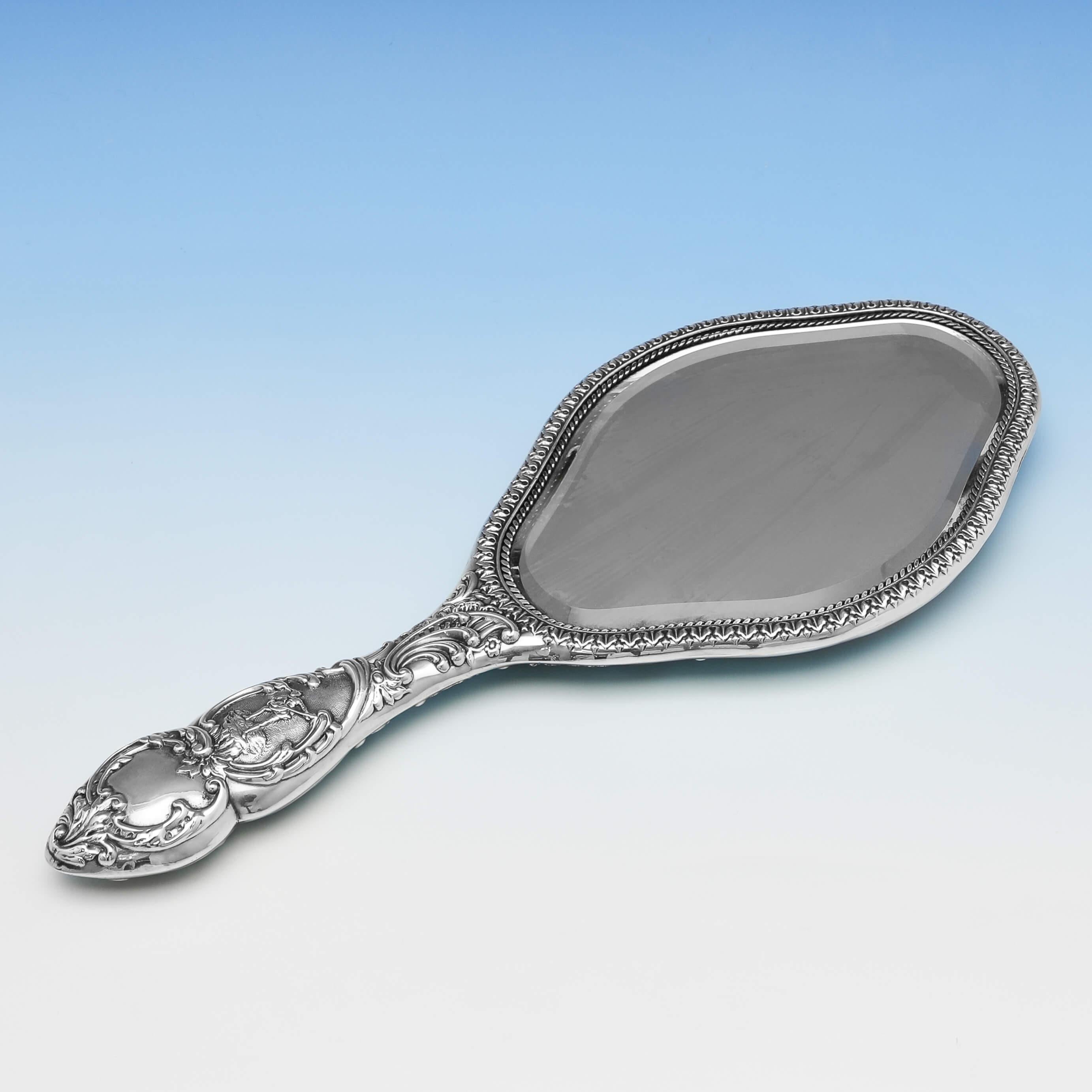 Hallmarked in Birmingham in 1901 by W. H. Wakefield, this attractive, Victorian, Antique, Sterling Silver Hand Mirror, features wonderfully chased decoration to the back and handle. The hand mirror measures 11