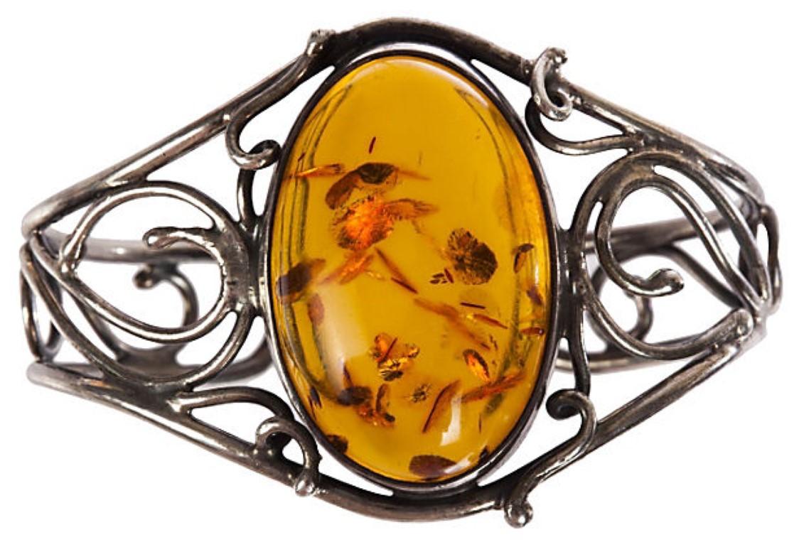 1970s sterling silver bracelet set with a Baltic amber cabochon. Interior, 2.25” x 1.875