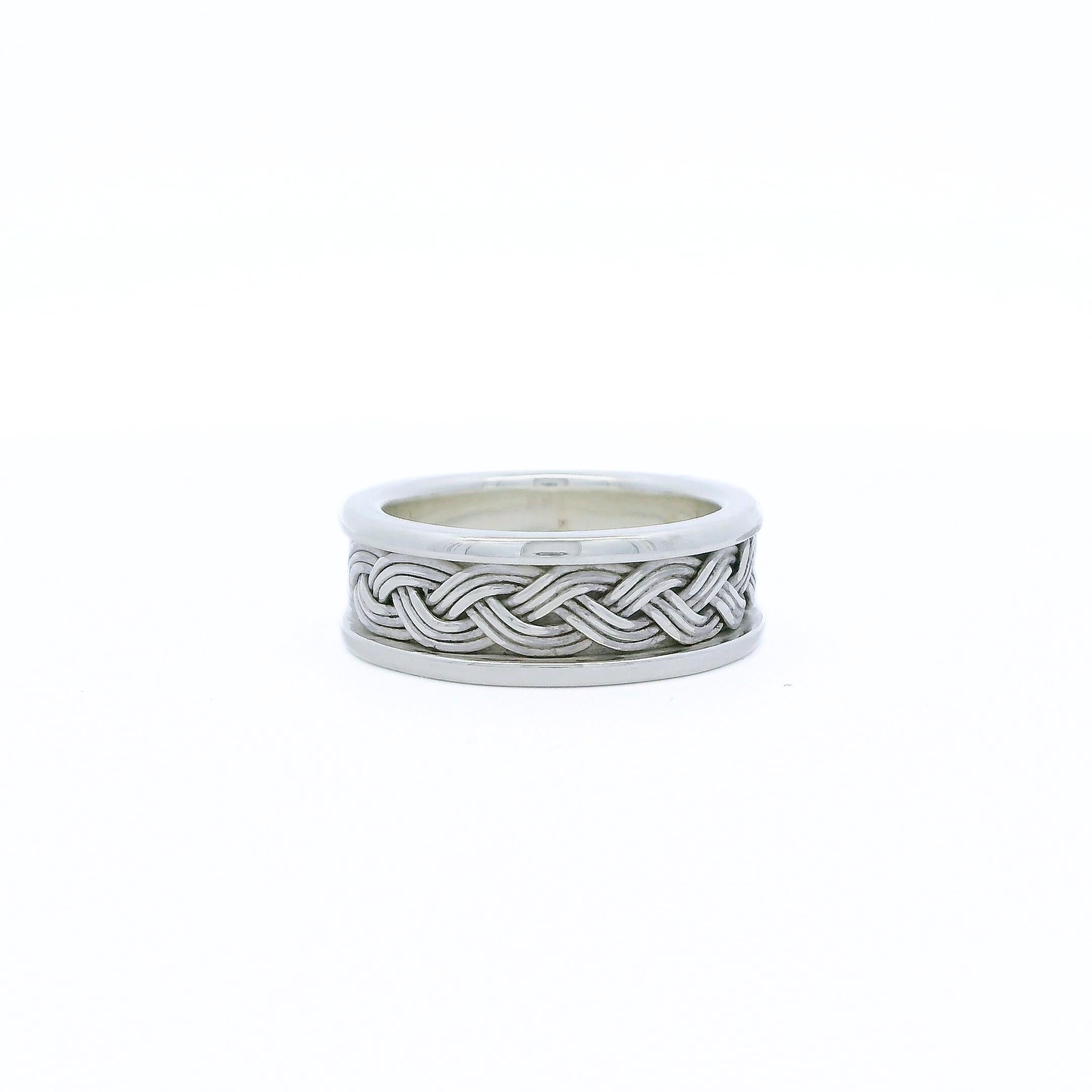 In this hand fabricated artisan ring, nine fine strands of 925 icy sterling silver are hand braided together to create an intricate 
