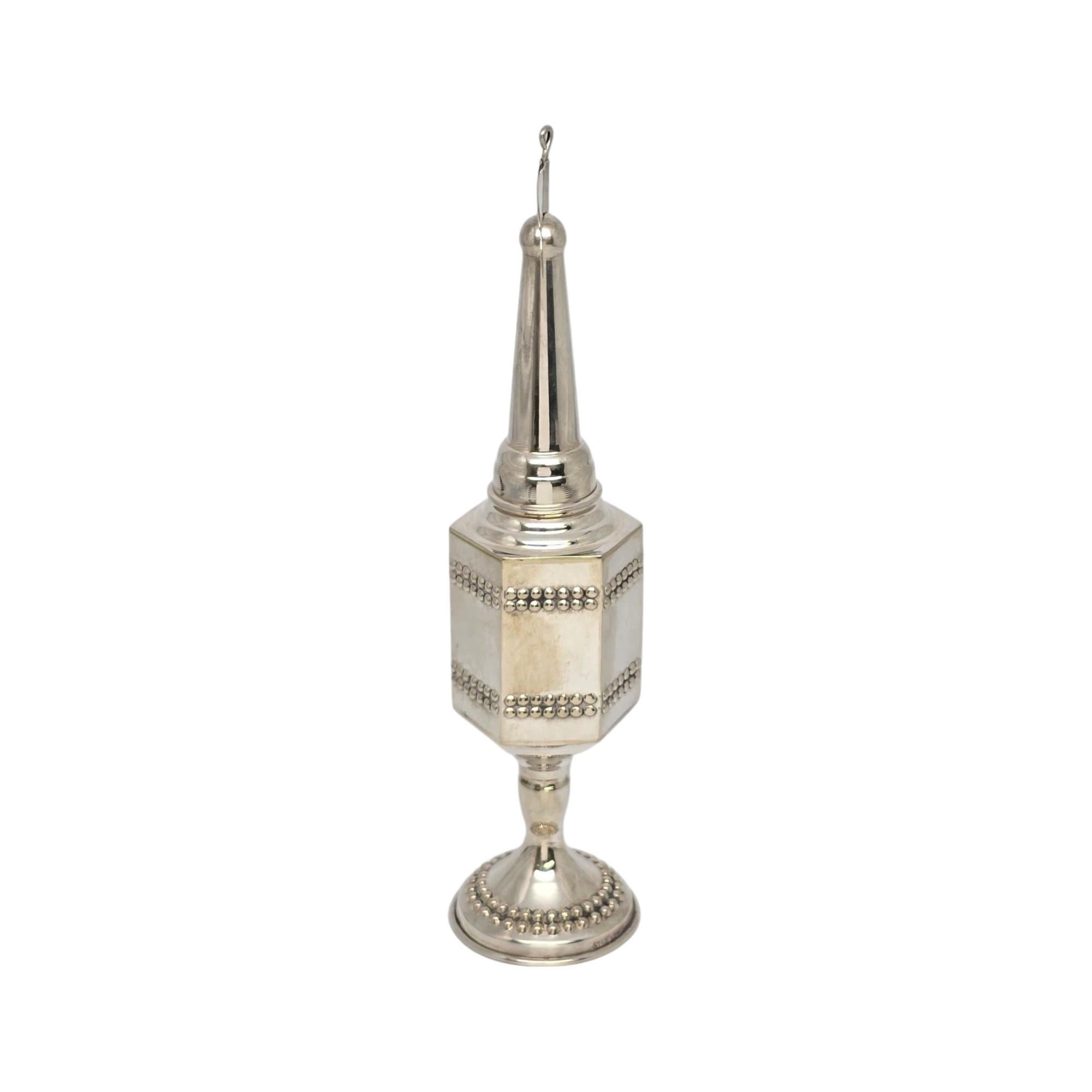 Sterling silver Havadalah Spice Box Besamim Spike Tower.

No monogram or engraving

This spice box for a Havadalah ceremony features silver pearl design accents on a hexagon tower with a flag at top.

Measures approx 8 5/8
