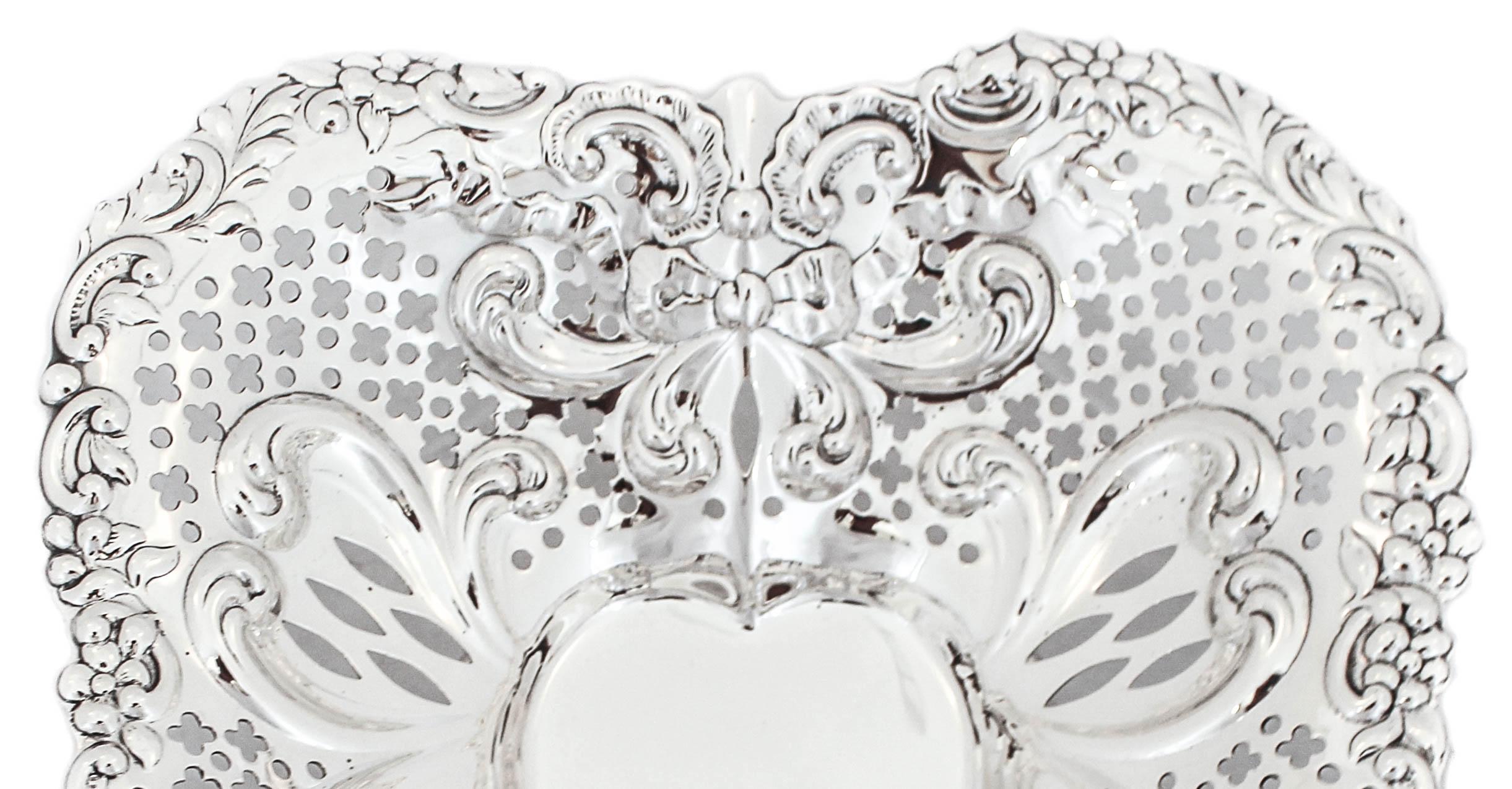 Love will be in the air with this gorgeous sterling silver heart dish by Gorham Silversmiths. It has a reticulated pattern all around the sides with a fluted rim. Imagine this filled with chocolates resting on your coffee table!