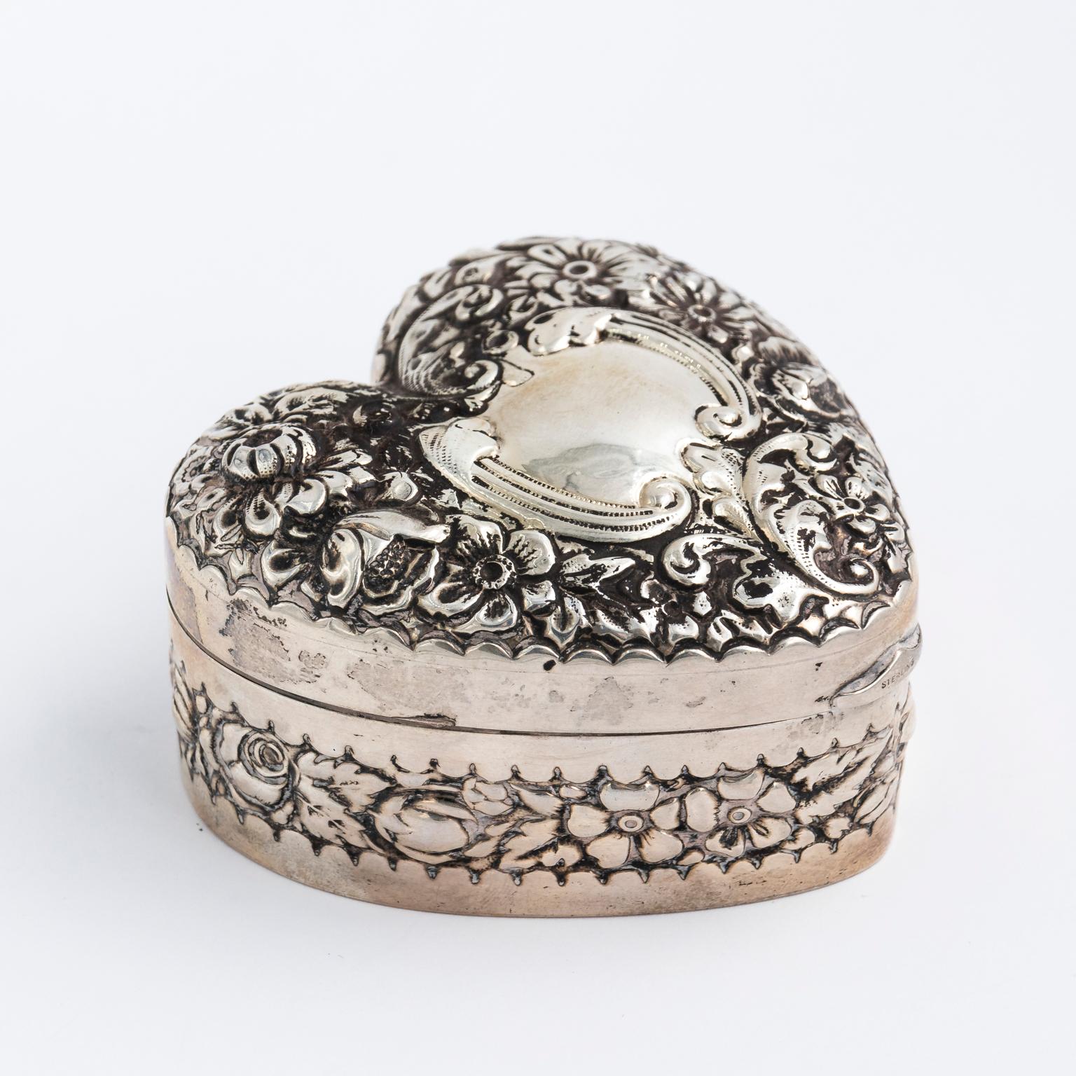 Sterling silver heart shaped box by Gorham for the Spaulding Company. It weighs 2.43 troy ounces with a hinged lid and red velvet lining.
 