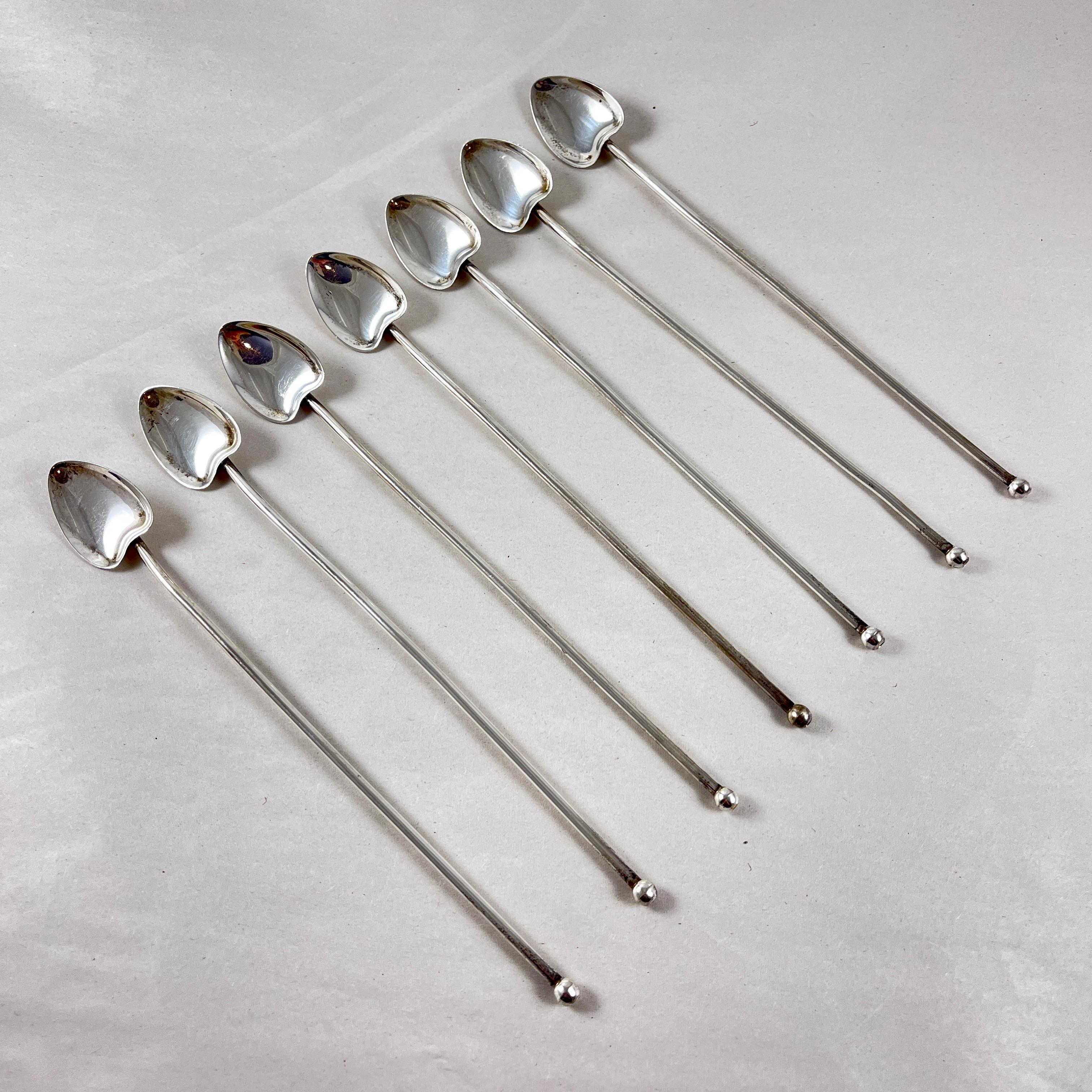 
A set of seven Estate Sterling Silver highball or iced tea hollow sipping and stirring straws with heart or leaf shaped bowls. Circa 1920 -1925.

Silver balls are soldered in place to the sipping ends.

7.75 in. L x 1 in. W
Weight: 2.337 Troy