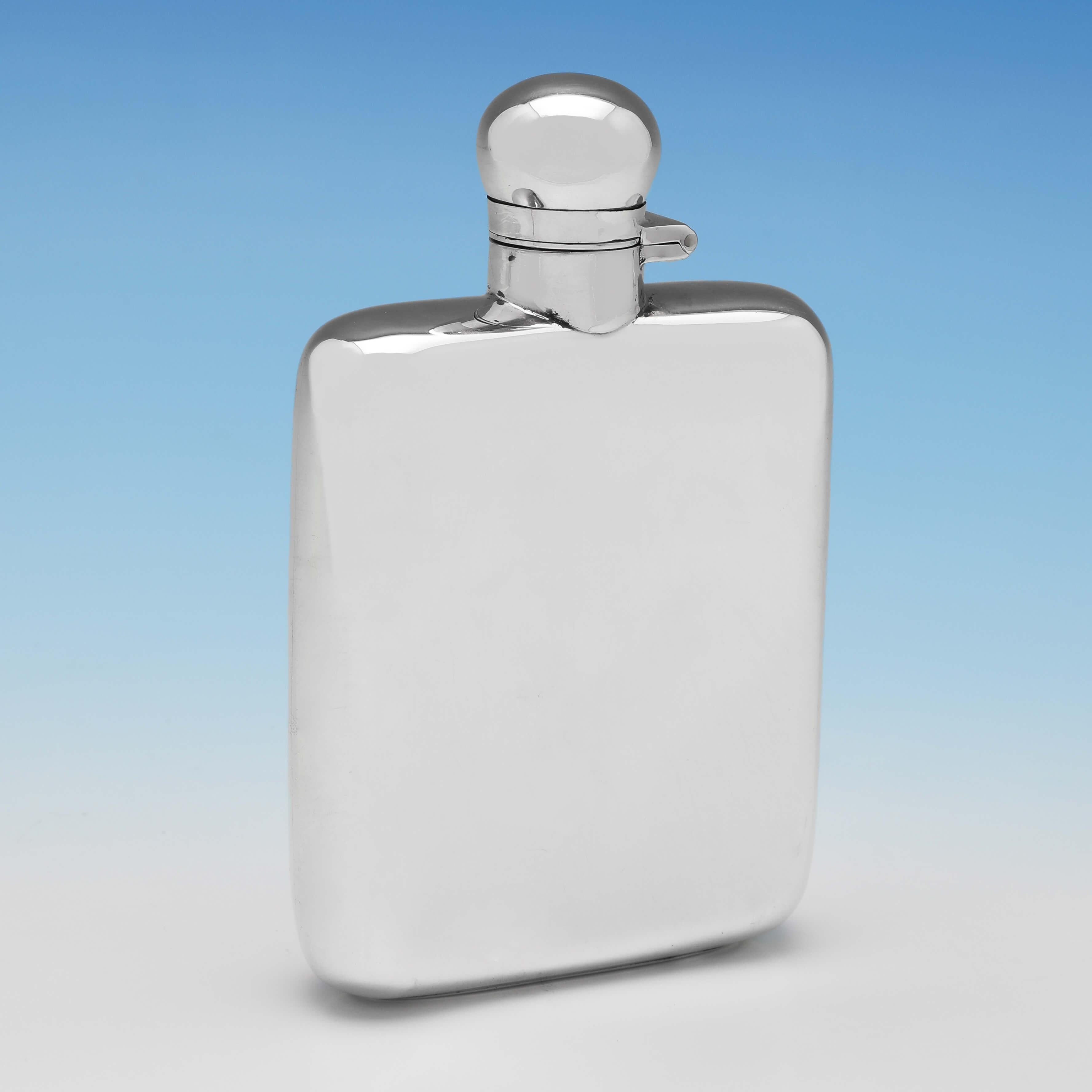 Hallmarked in Sheffield in 1923 by James Dixon & Sons, this handsome, Sterling Silver Hip Flask, is plain in style and features a bayonet cap. The hip flask measures 5