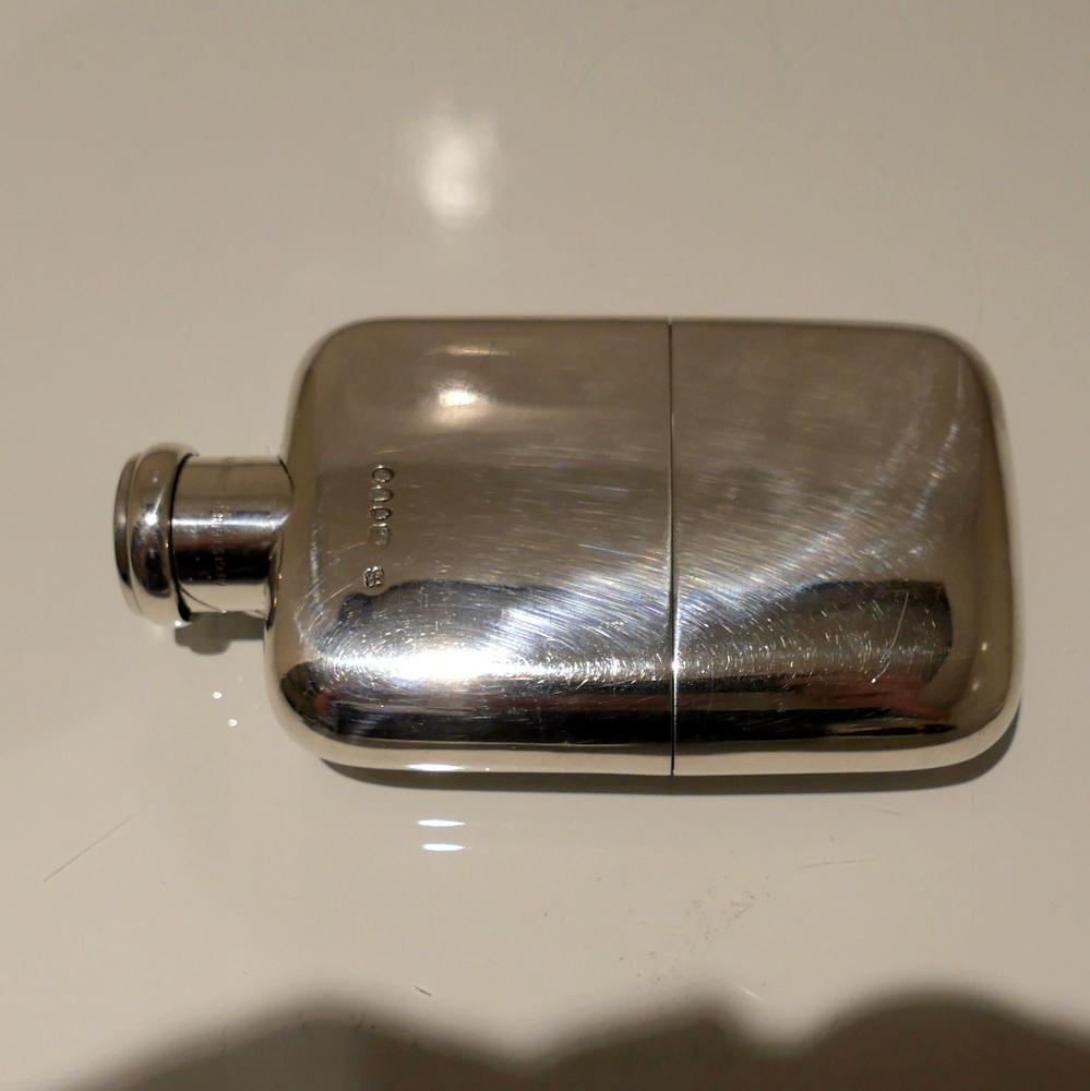 A splendid looking and incredibly fine sterling silver Victorian hip flask, plain formed in design and baring ‘featured’ hallmarks for decorative importance. The detachable ‘sleeve’ fitted beaker is has elegant gilding inside and the stylish ‘flip’